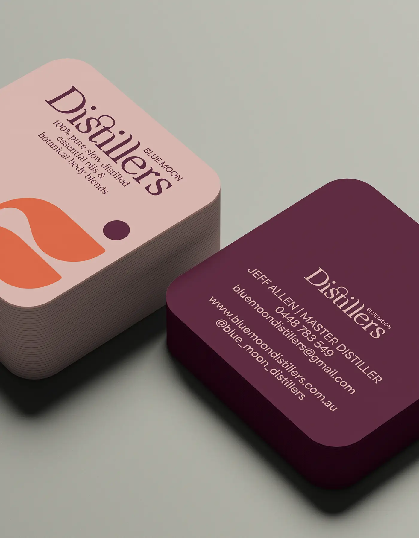 Blue Moon Distillers business card designs displaying brand palette and typography.