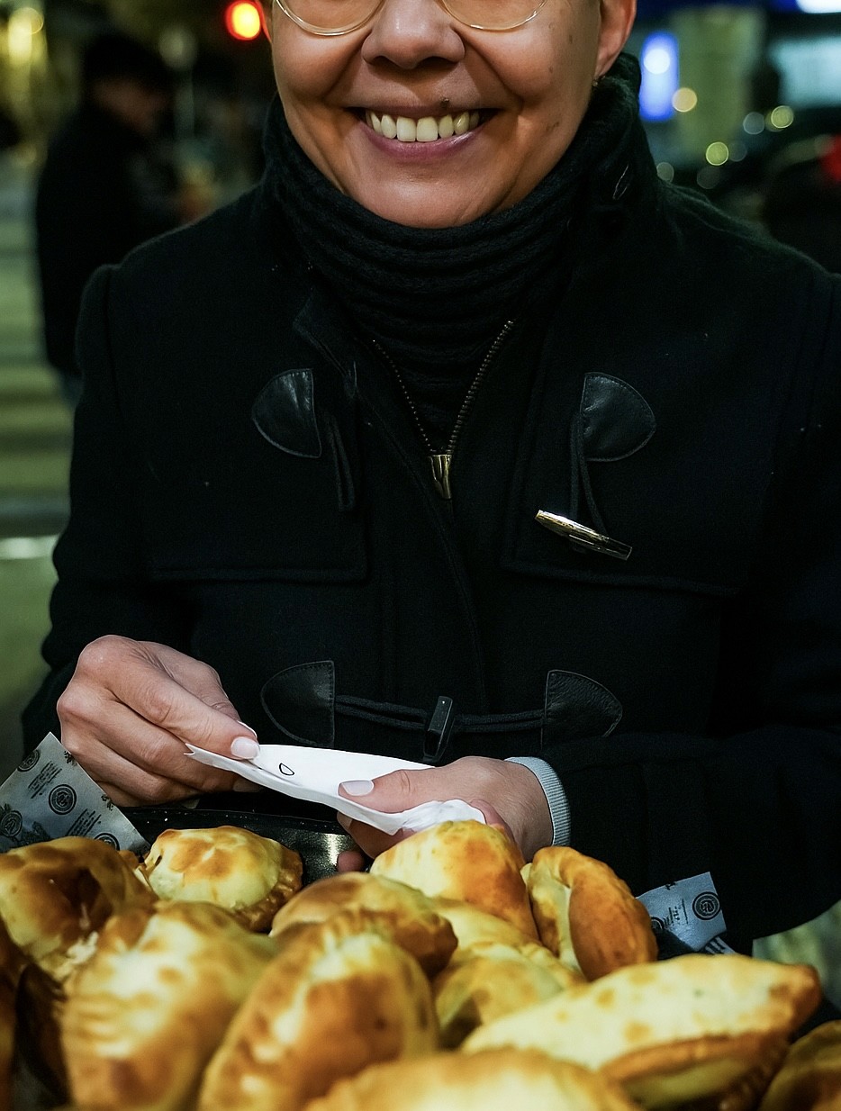a woman cooking food in an oven