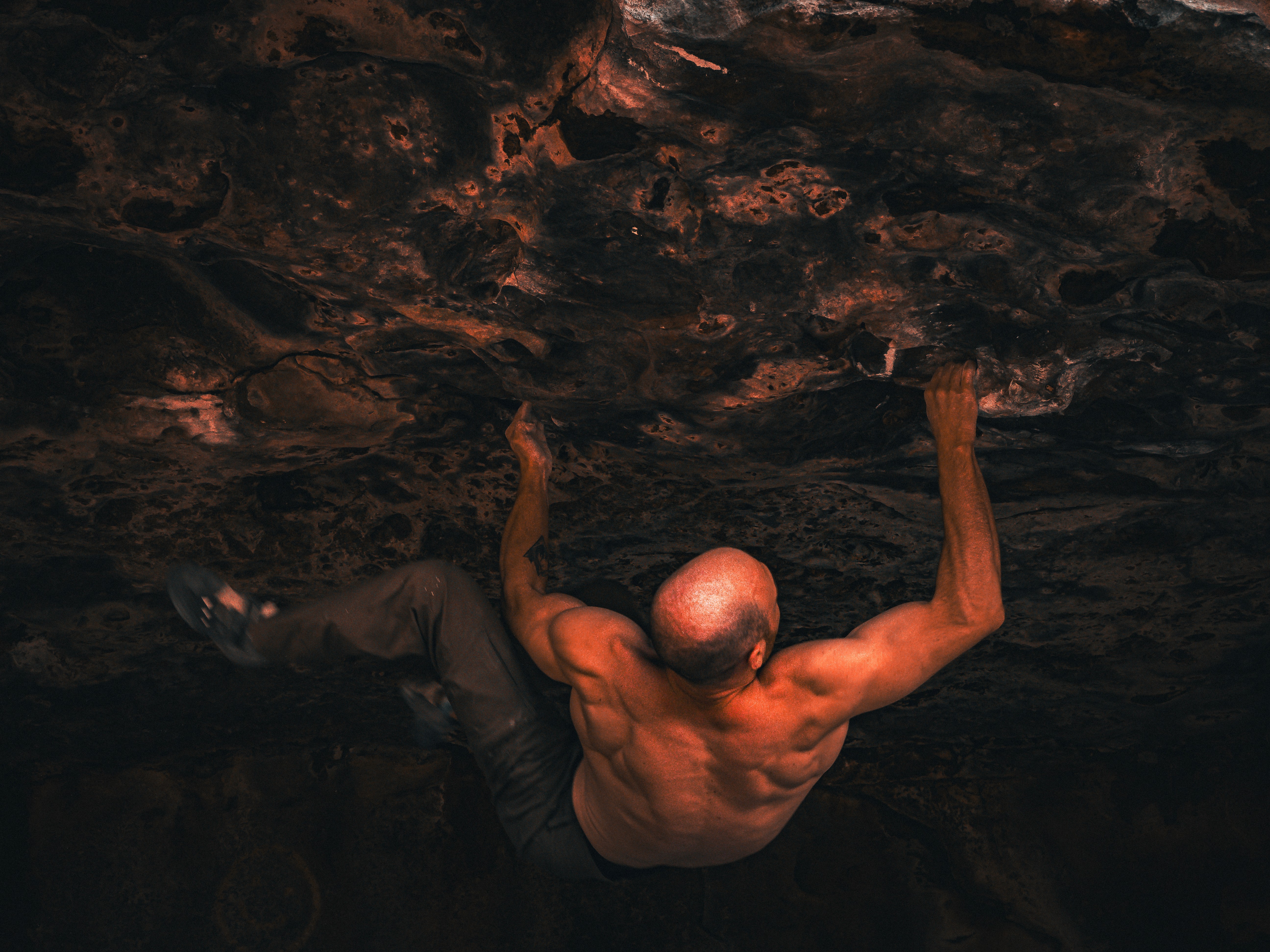Three models standing in a wheat field, wearing beige suits.