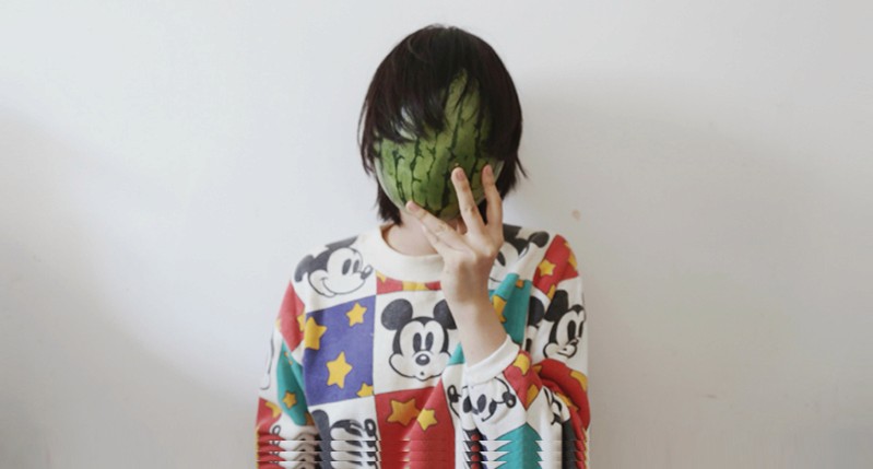 A women with a watermelon peel mask