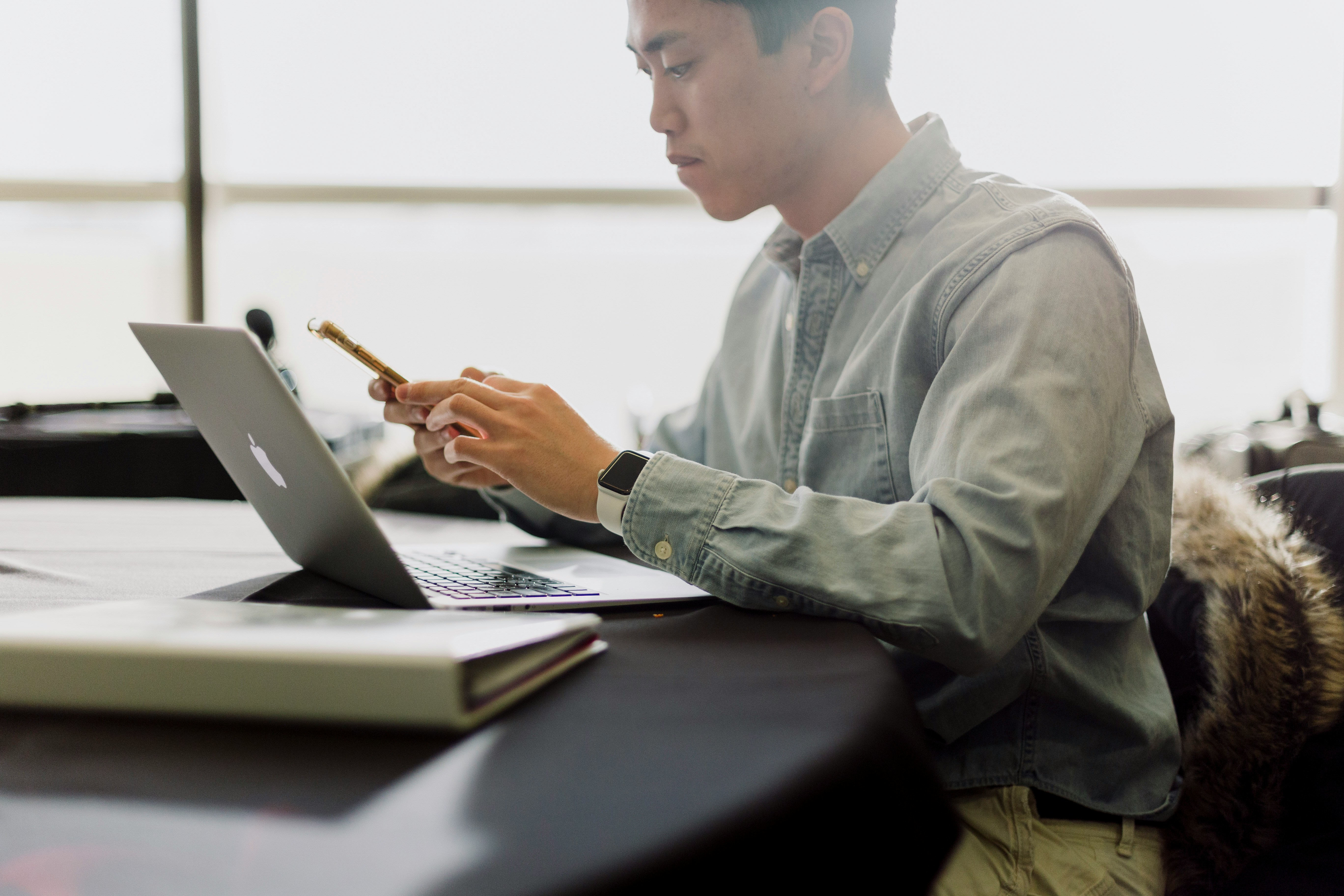 man with laptop and mobile - ChatGPT For Literature Review