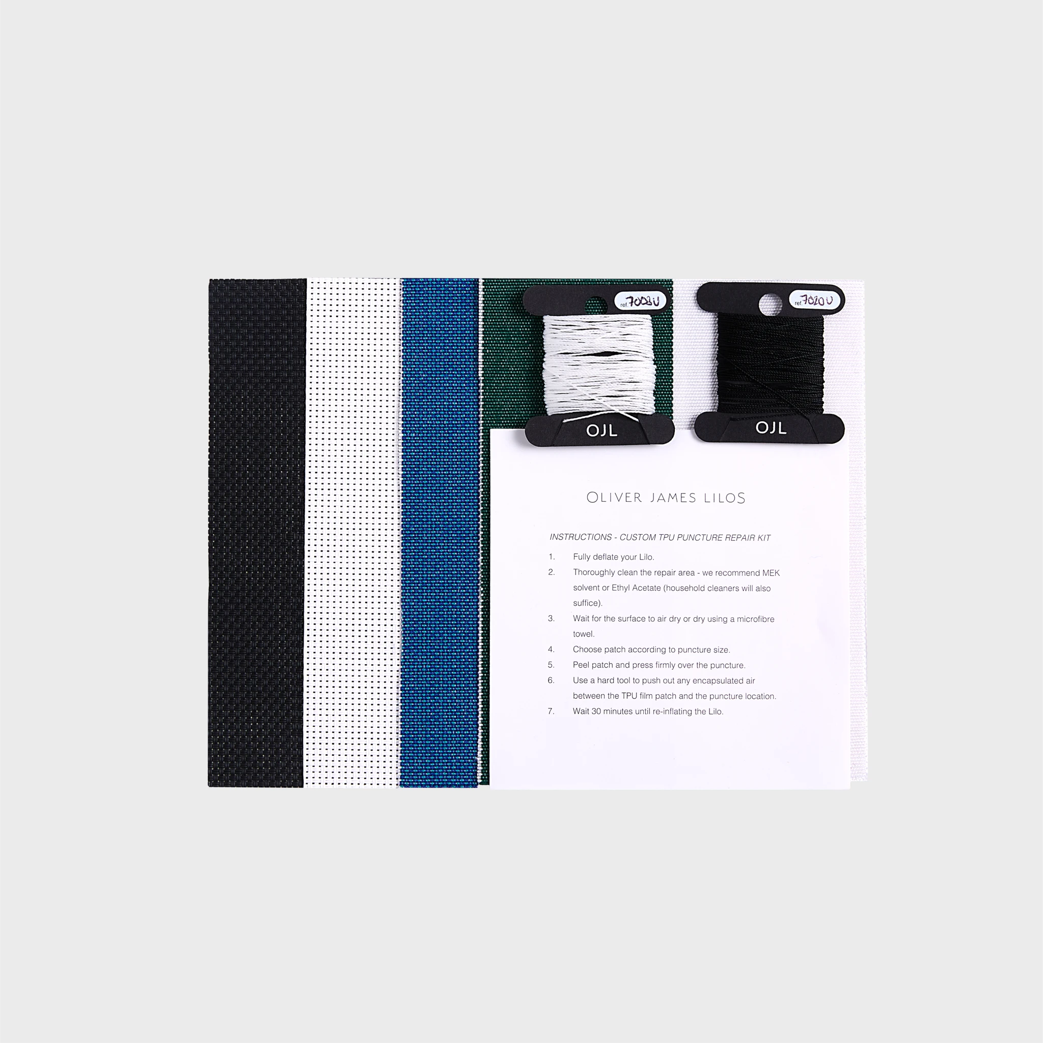 Oliver James Lilos custom repair kit with striped fabric swatches, black and white thread spools, and TPU puncture repair instructions — designed for seamless luxury float maintenance.