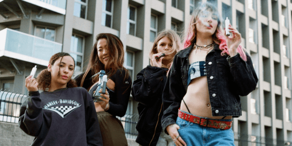 group of people using heat not burn devices