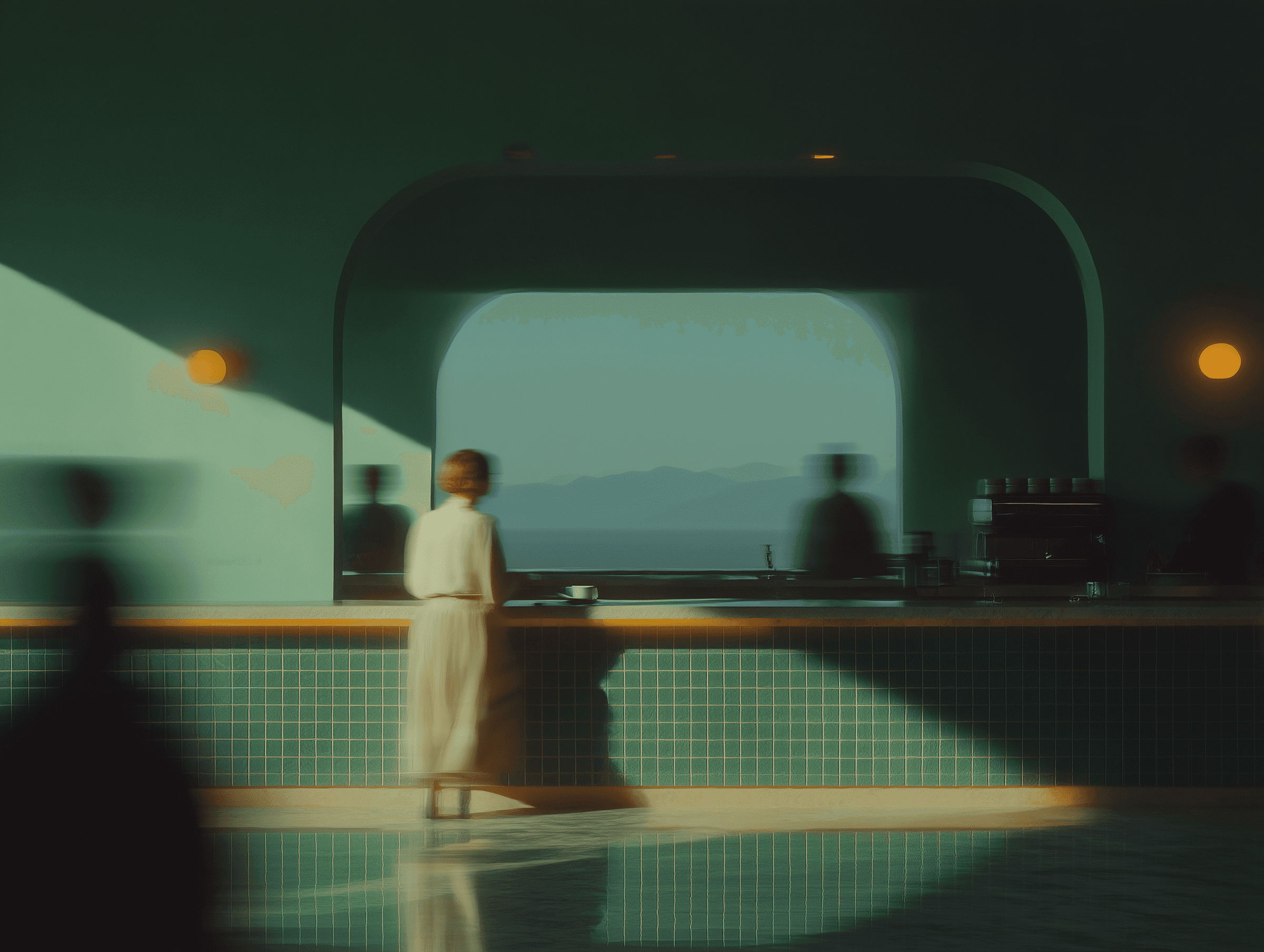 A dimly lit room features a person walking past a counter, with a serene view in the background.