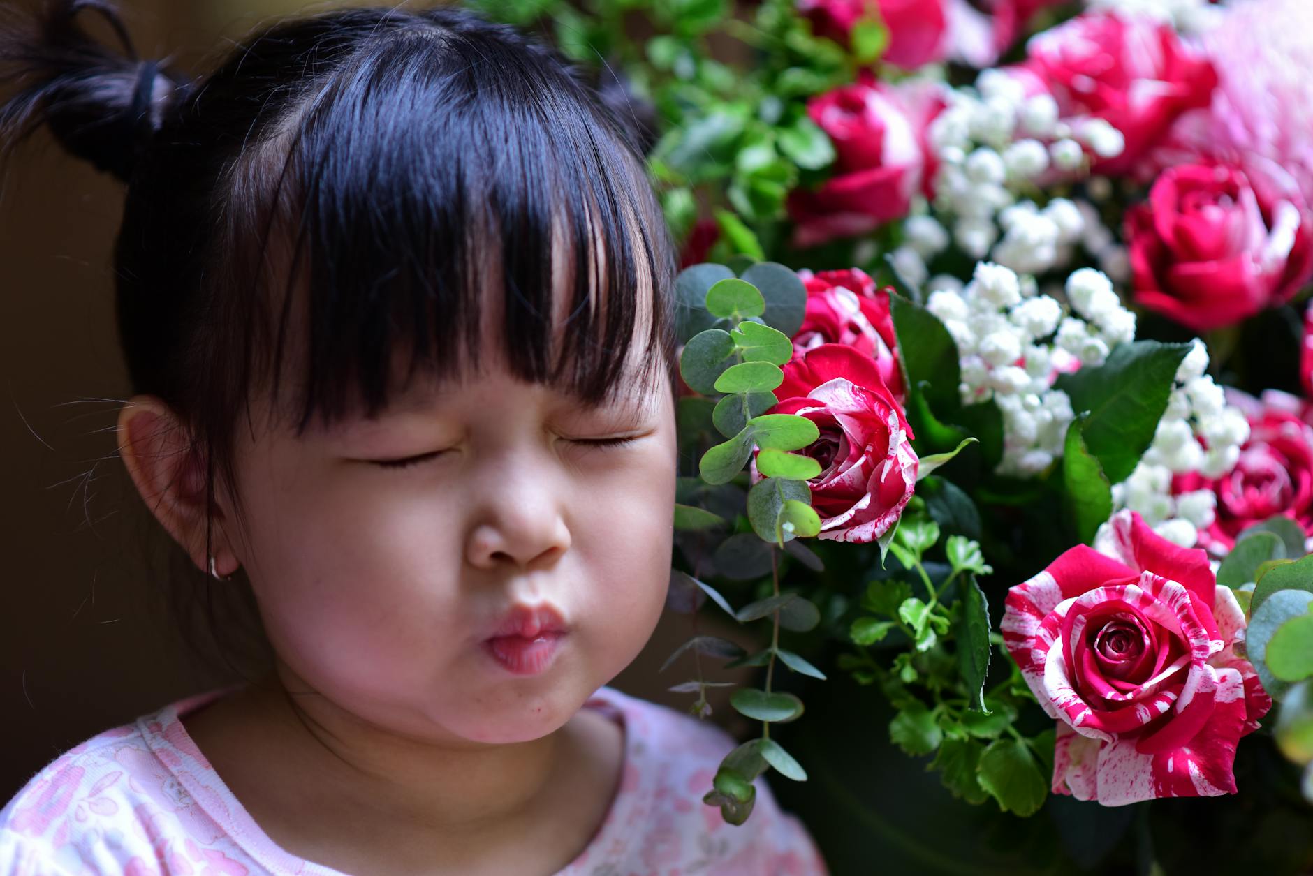 A group of children standing quietly with eyes closed practicing deep breathing and slow yoga poses.