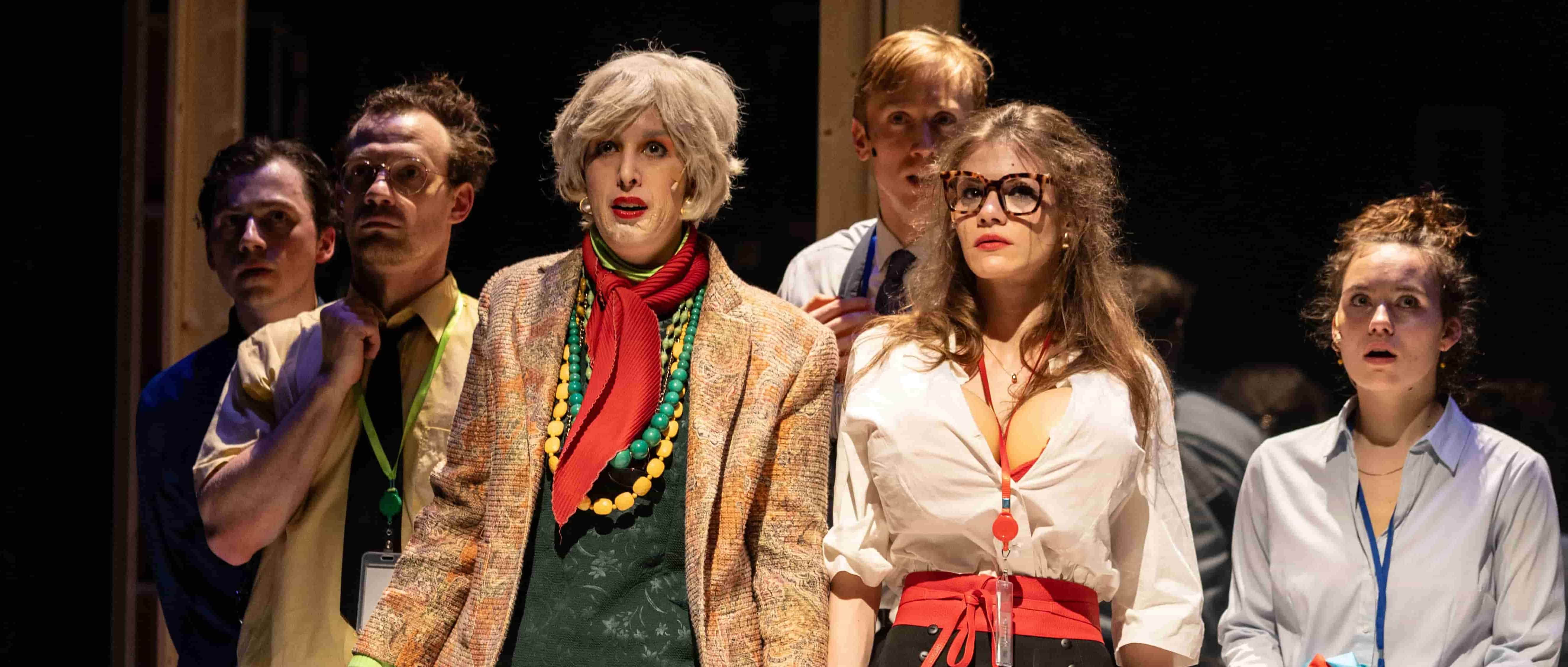 An orange cube-shaped side table is shown.