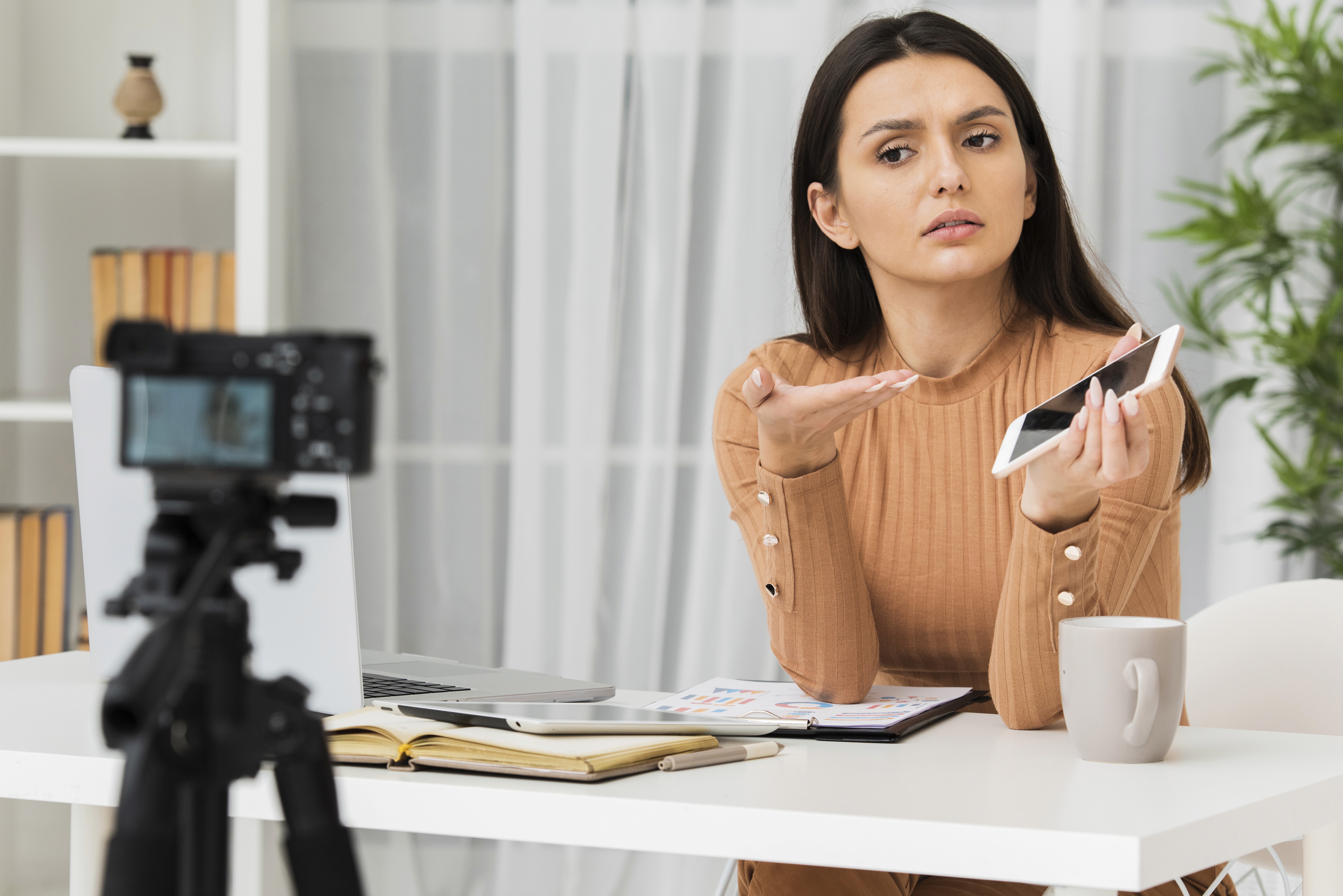 Creator filming TikTok Shop video looking confused, representing unclear product explanation and weak shoppable video content quality.
