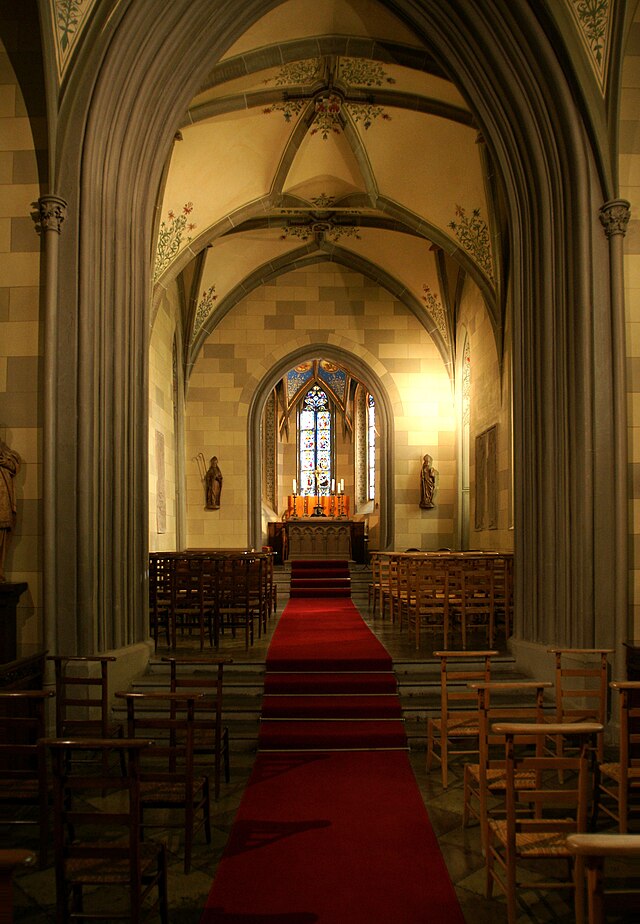 a tree with pink flowers in front of a store