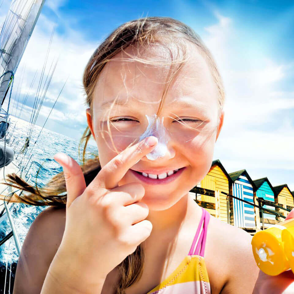 girl putting sunscreen on her nose