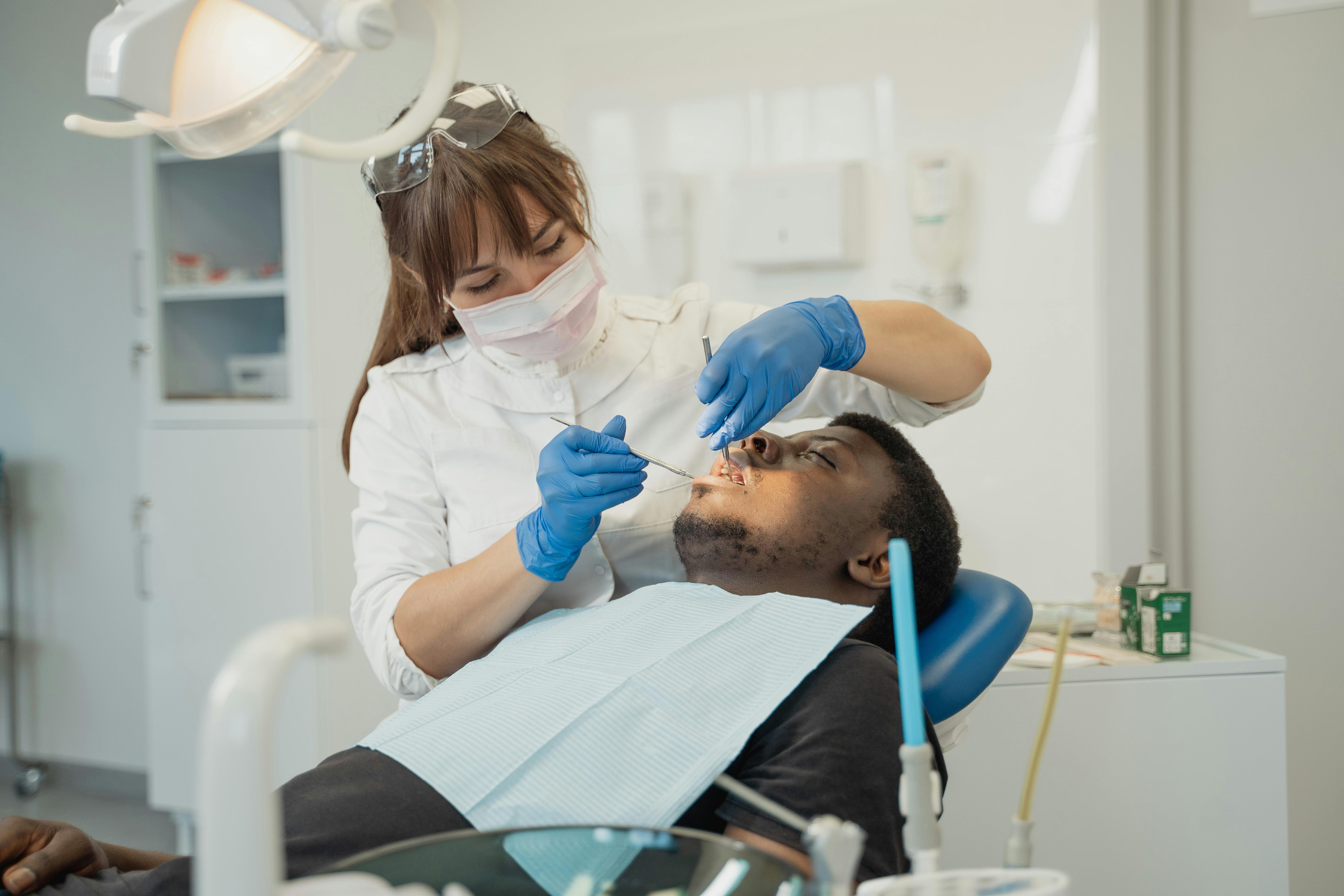 Dentist cleaning teeth