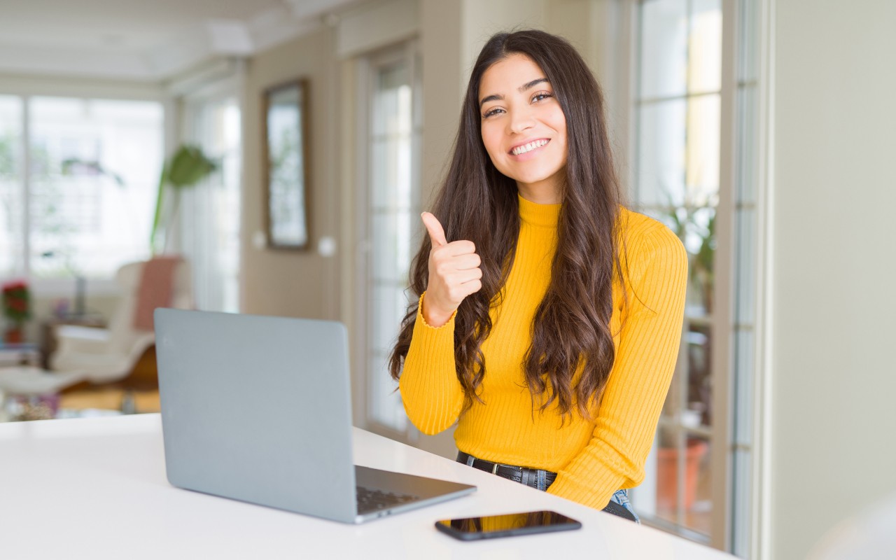 A girl giving a thumbs up for elevate.io
