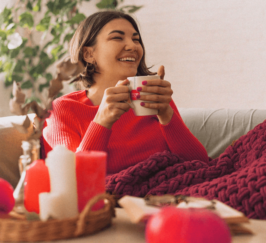 Red Rose Life Style Image, Woman drinking tea on couch
