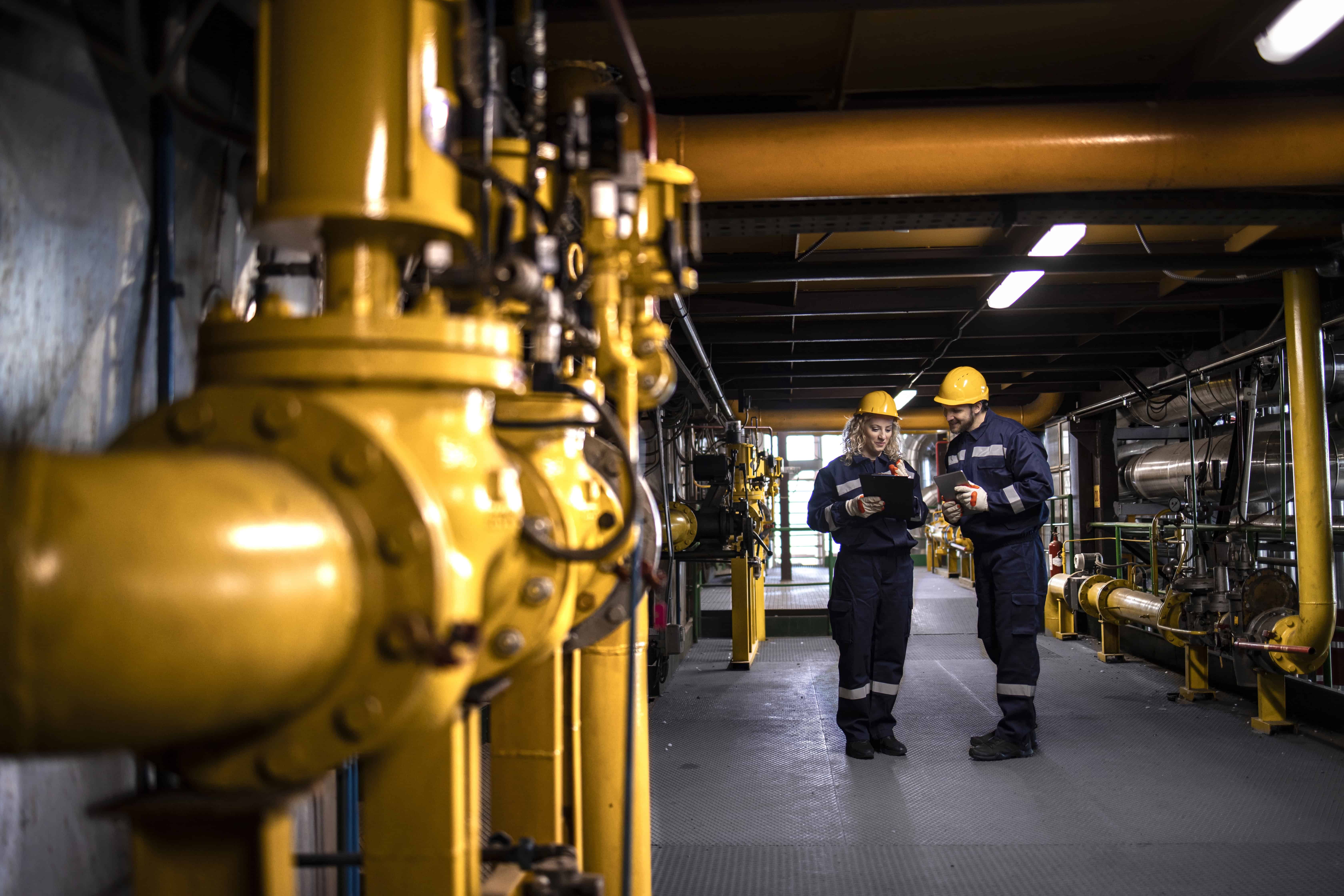 Two workers doing a psychosocial risk assessment prior to commencing their task on an offshore facility
