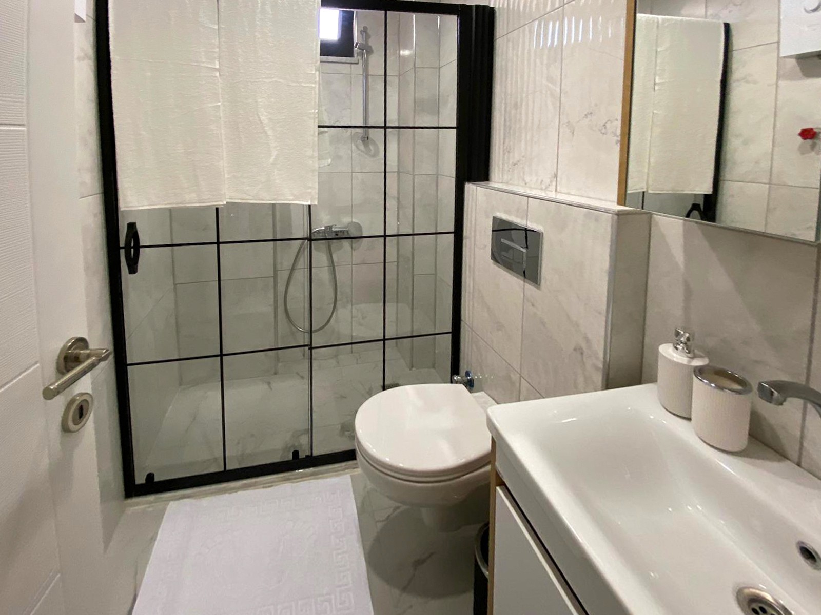 Modern bathroom in 1 bedroom apartment at Zen Garden Suites Side Antalya