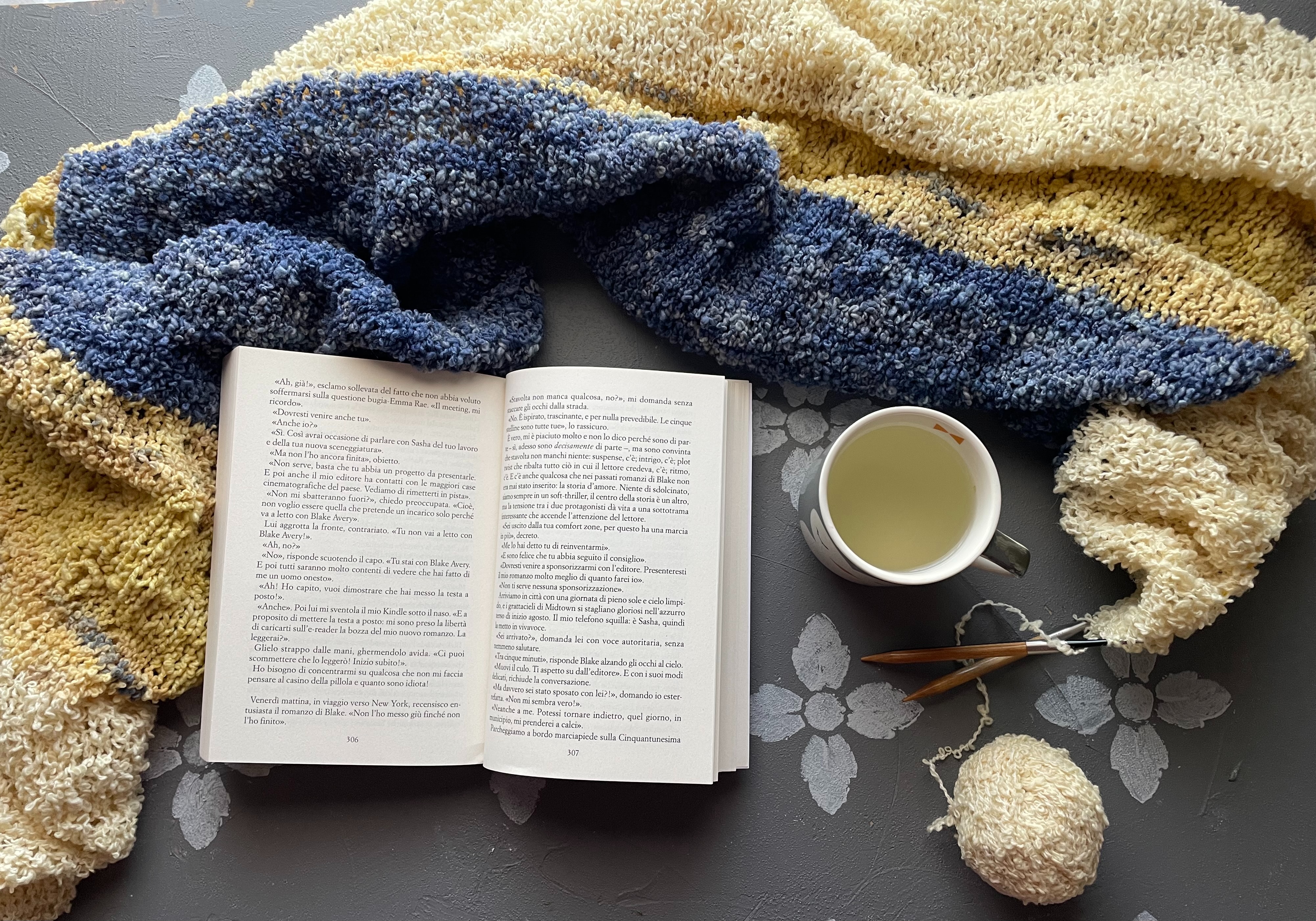 image of an open book with blanket and teacup