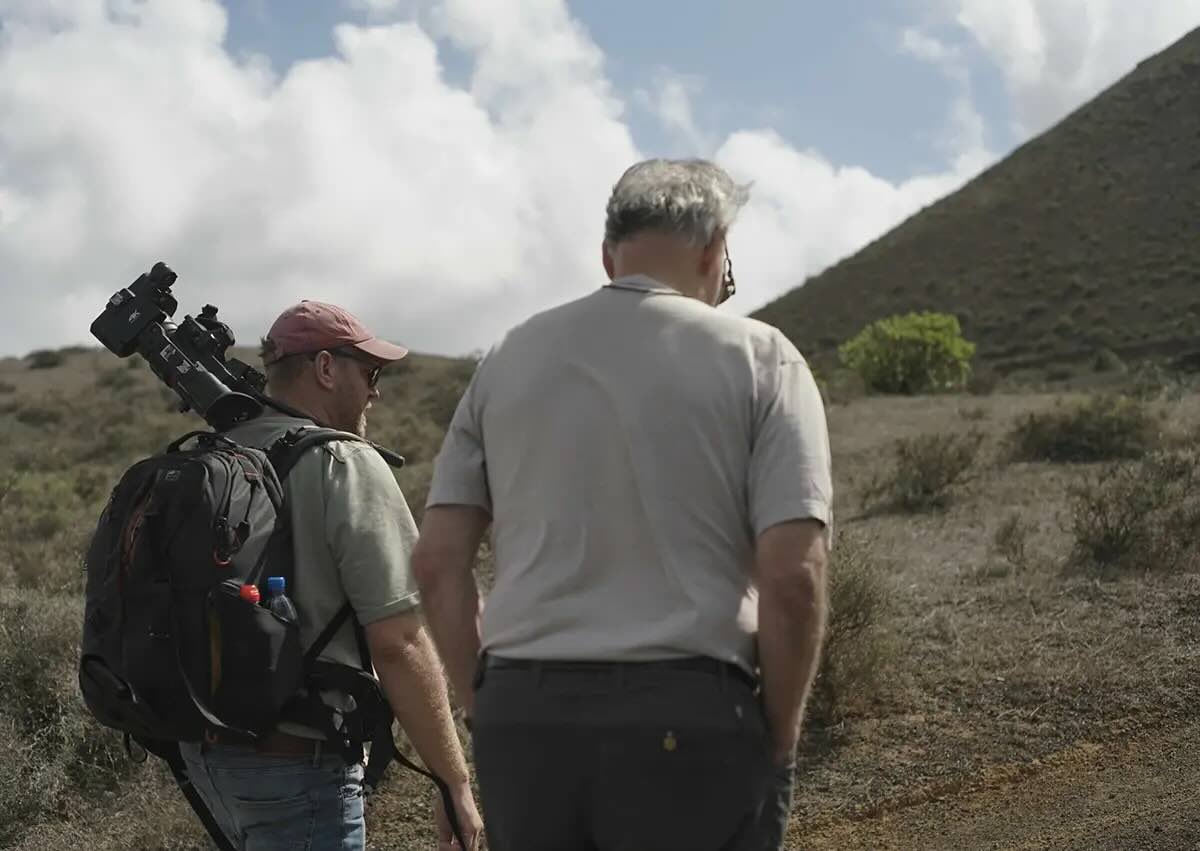 Tim van den Hoff and Werner Herzog scale a volcanic terrain in Lanzarote.