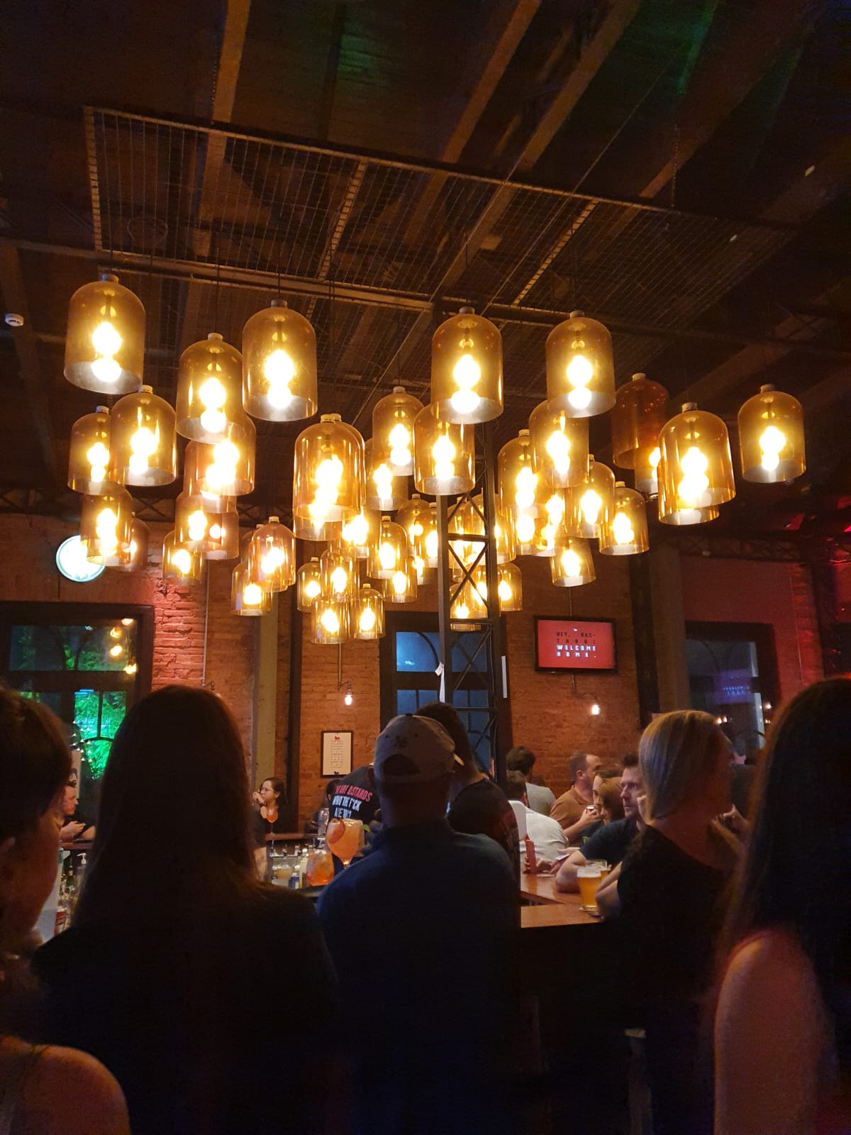 people in a large building with Tate Modern in the background