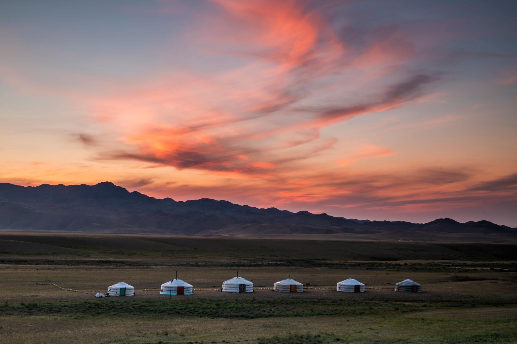 photo of brown bench near swimming pool