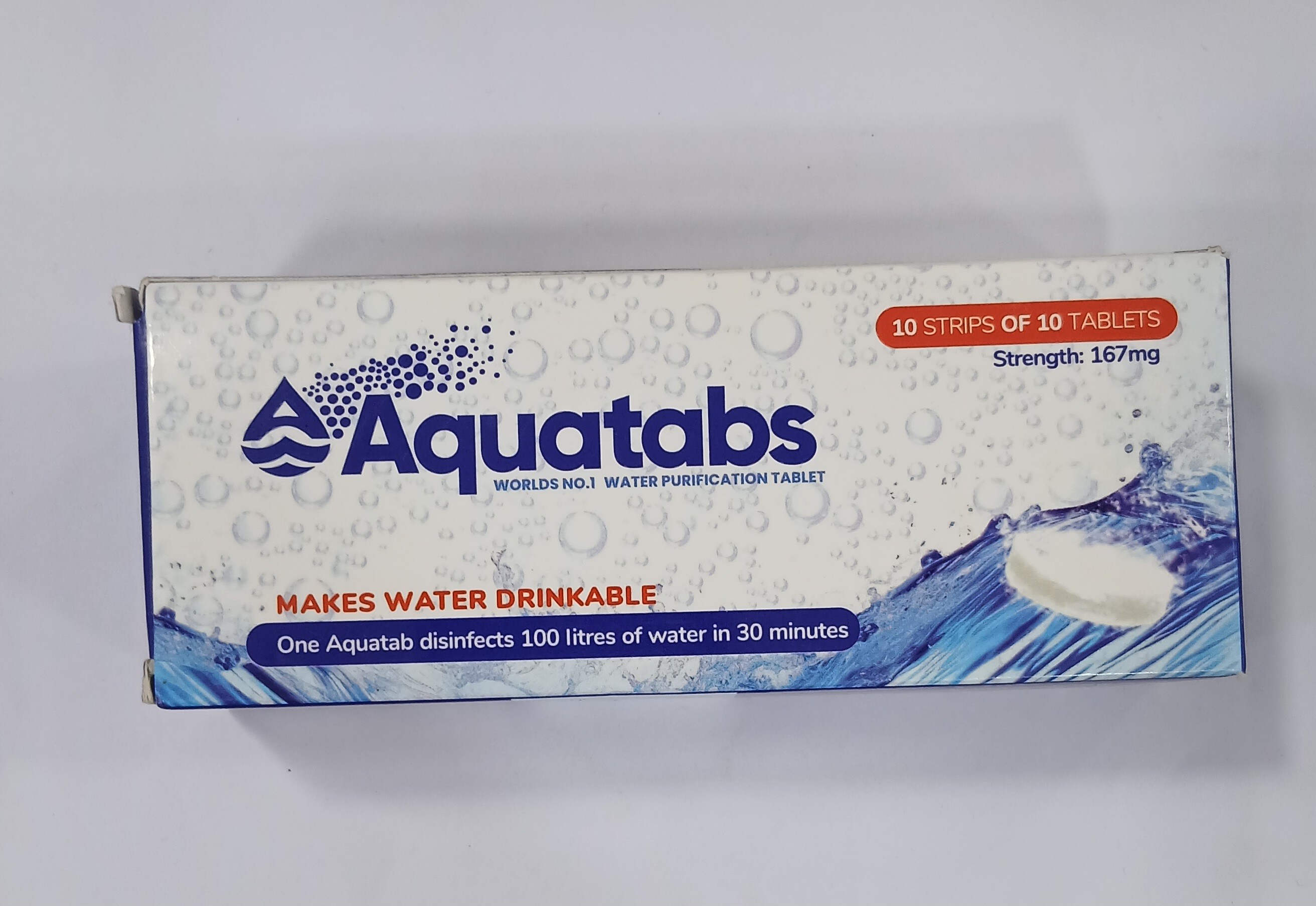 White cardboard box packaging displays a blue and white design with water-themed graphics, text stating it contains 30 effervescent tablets weighing 167mg each, and claims about making water drinkable in 30 minutes.