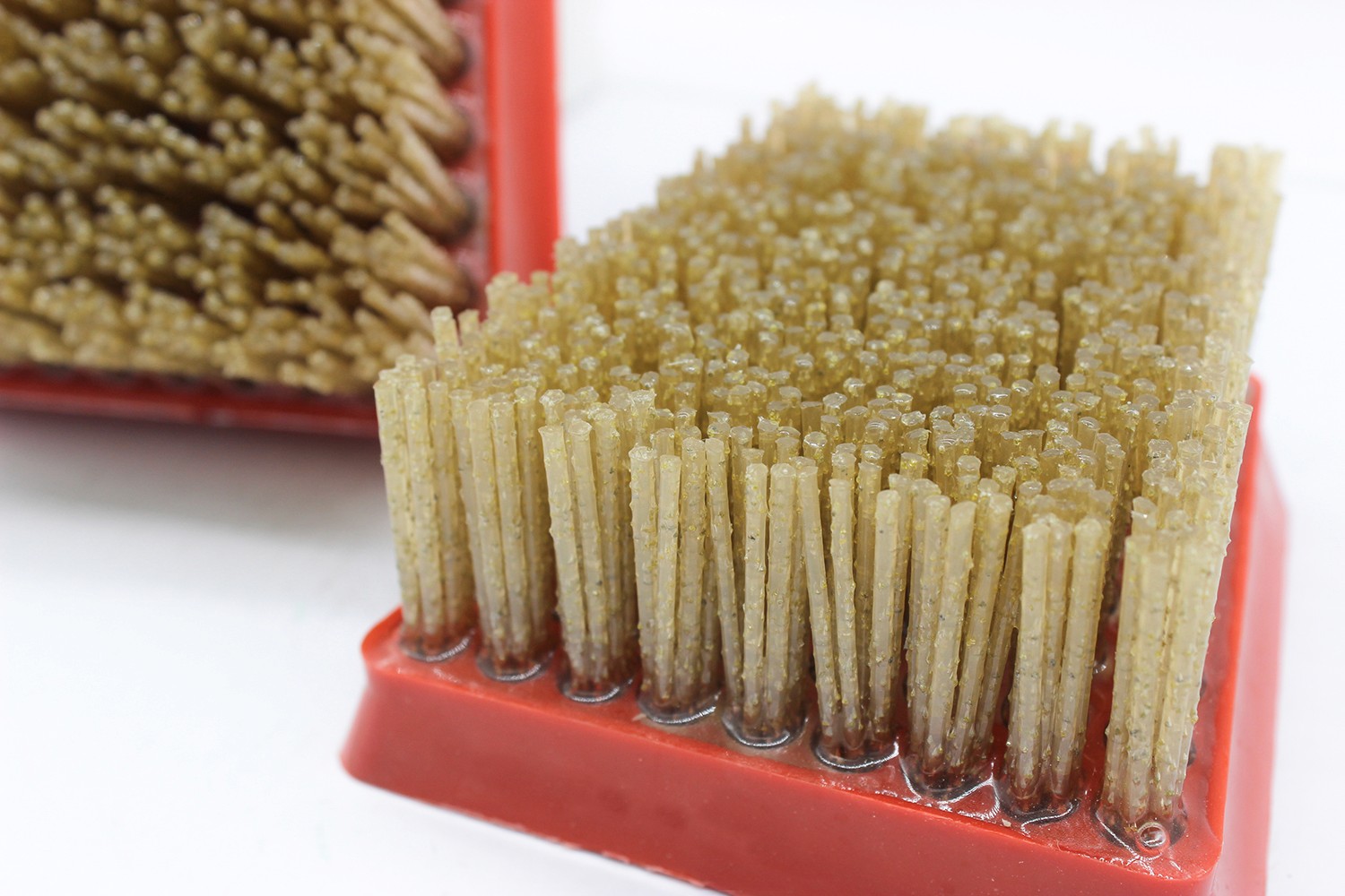 Close-up of the diamond abrasive brush, focusing on the bristle tips and texture.