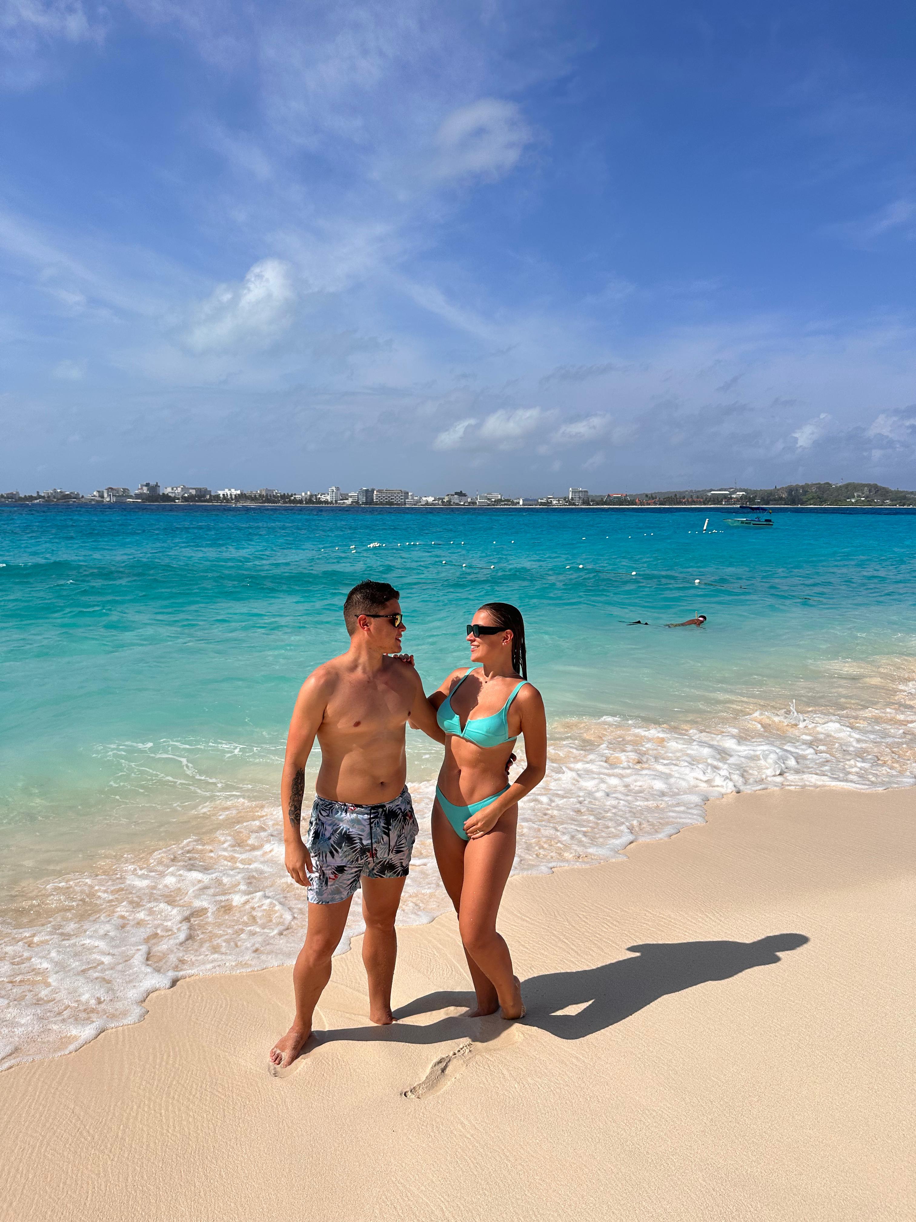 Woman logistics manager using a tablet in a busy warehouse.