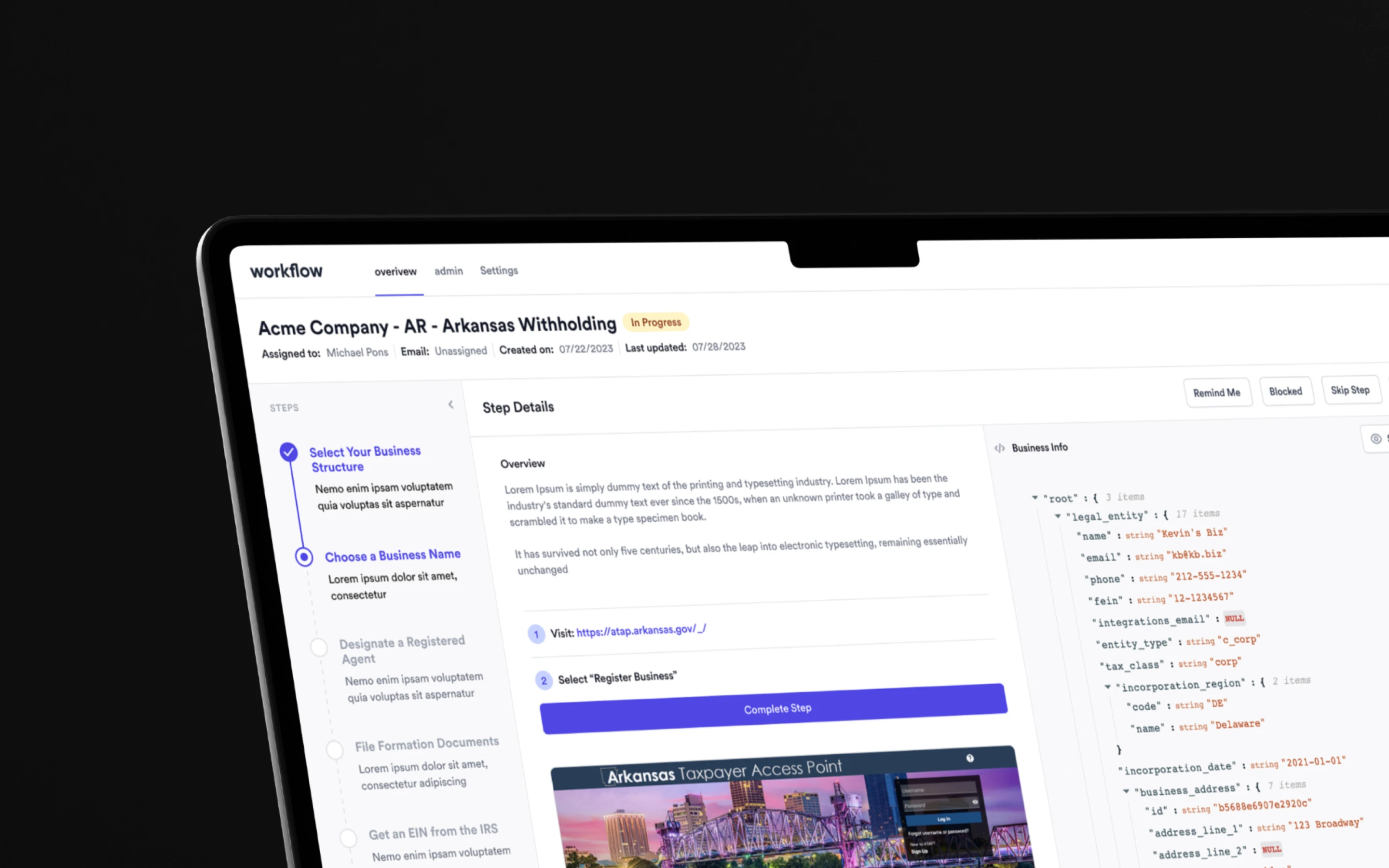 Laptop on orange chair displaying SaaS application on browser.
