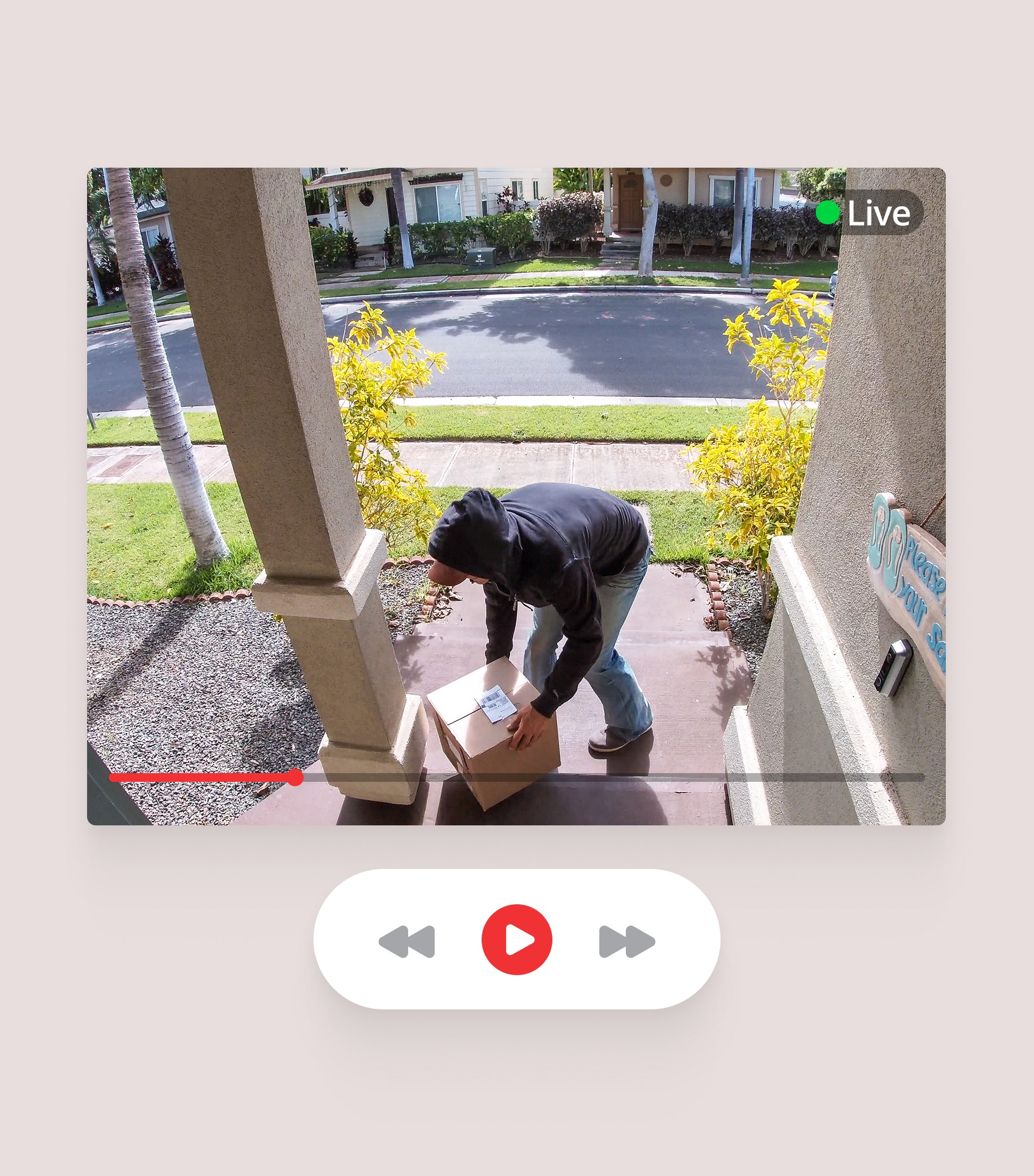 Honeywell smart home camera interface capturing live video of person collecting package at doorstep
