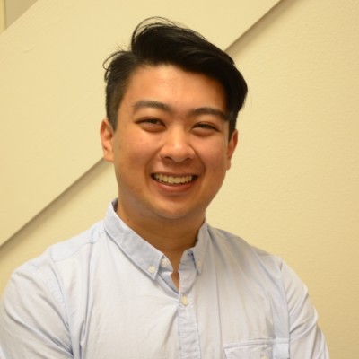 man standing beside wall