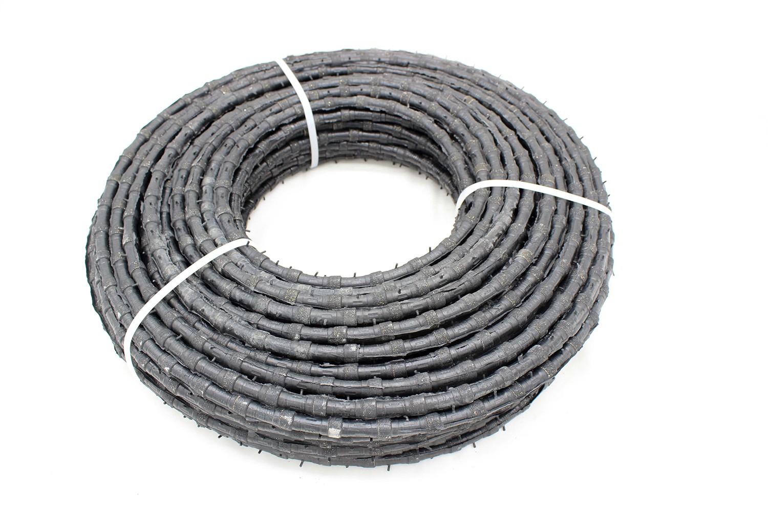 Complete coiled Diamond Wire Saw, emphasizing its readiness for marble quarrying and block squaring applications.