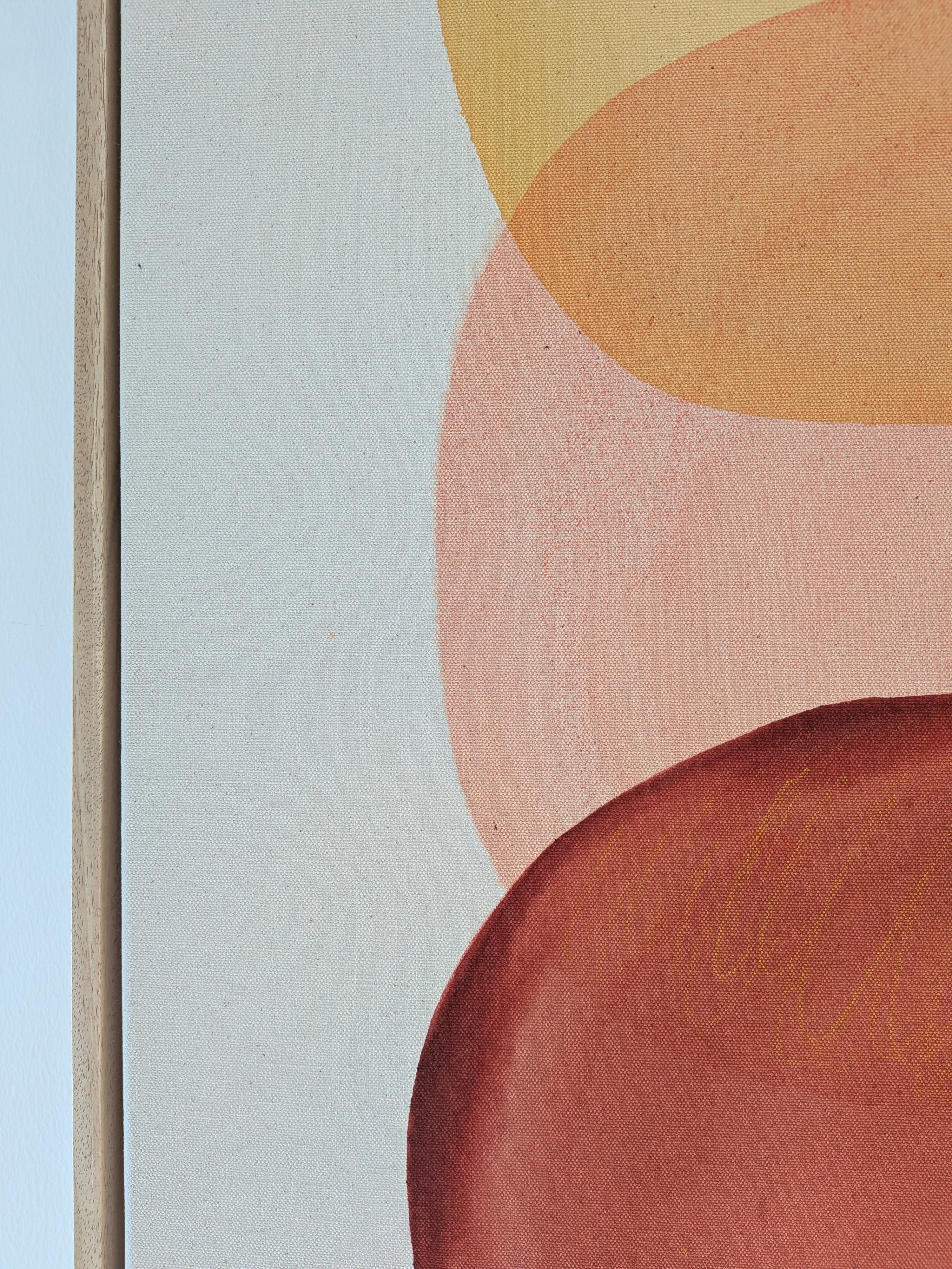 Two purple, oval shapes stacked vertically within a thin, gold frame against a light background.
