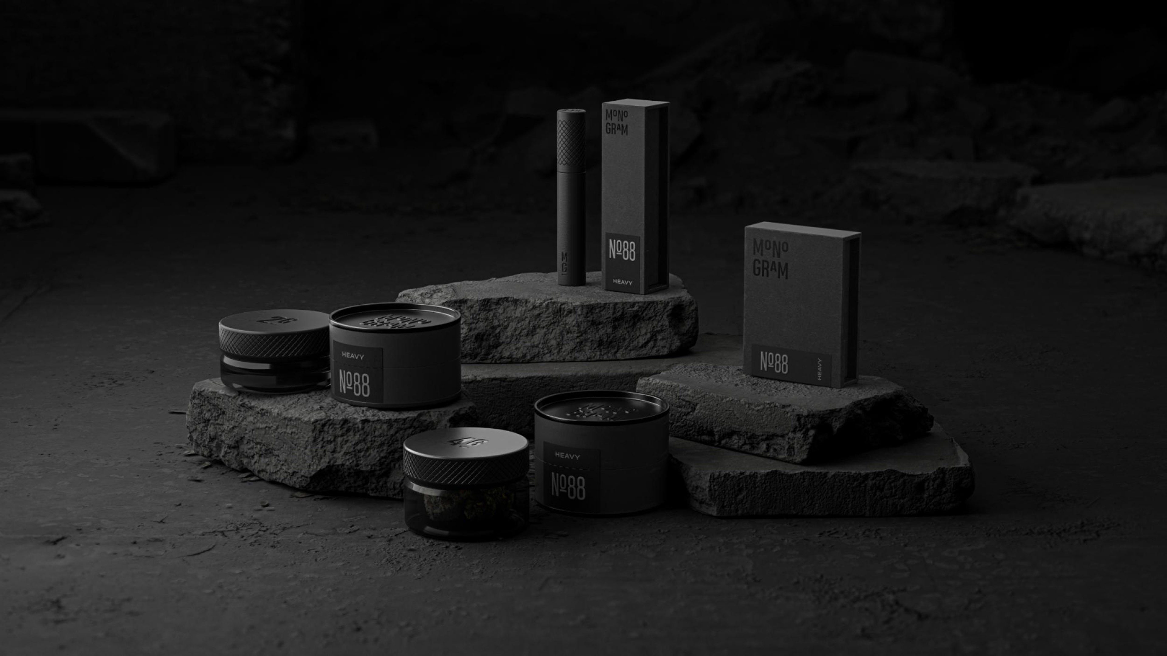 3D render showing a group of Monogram cannabis products arranged on stone slabs
