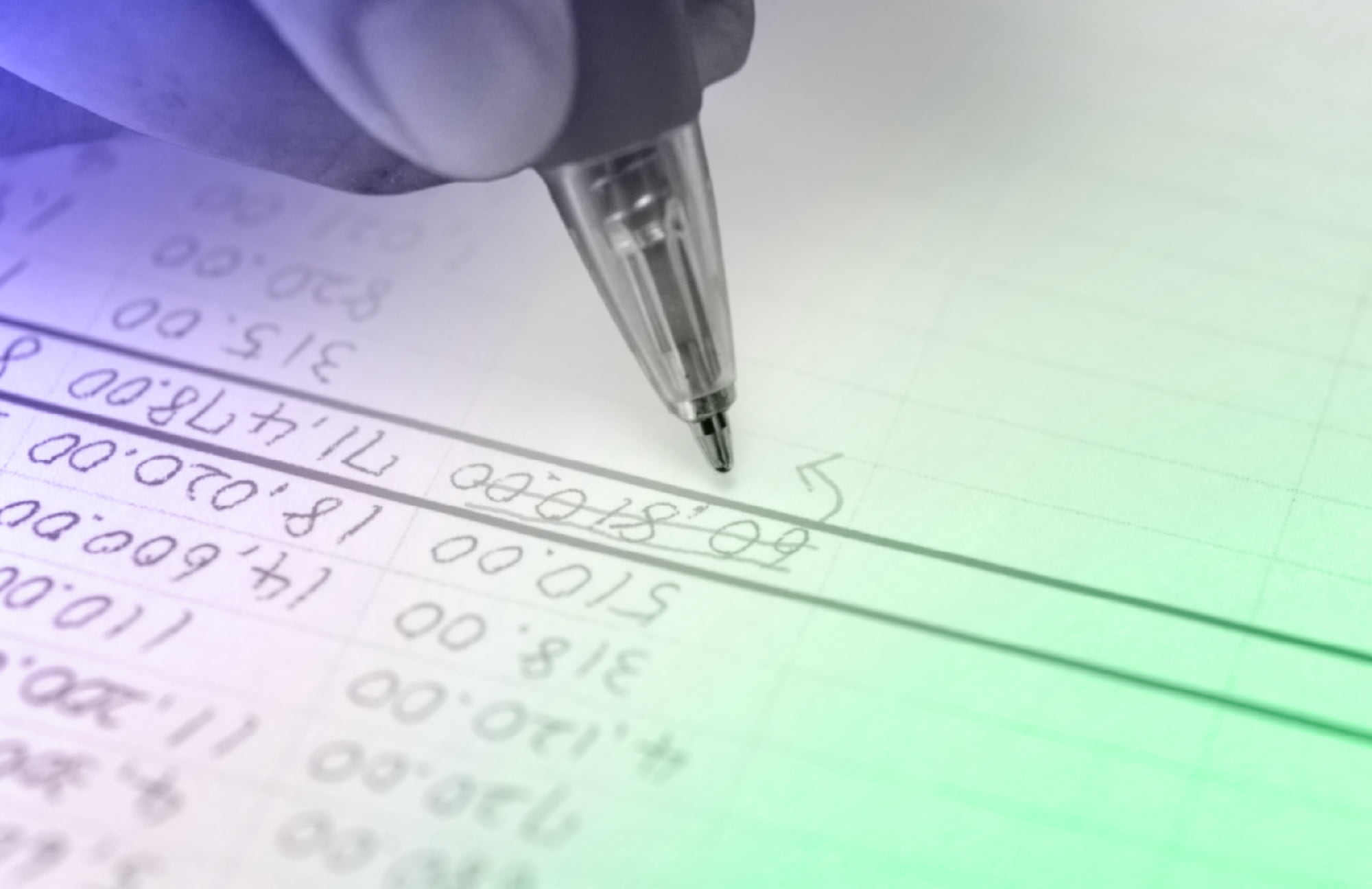 Close-up of handwritten financial figures in a ledger during monthly reconciliation
