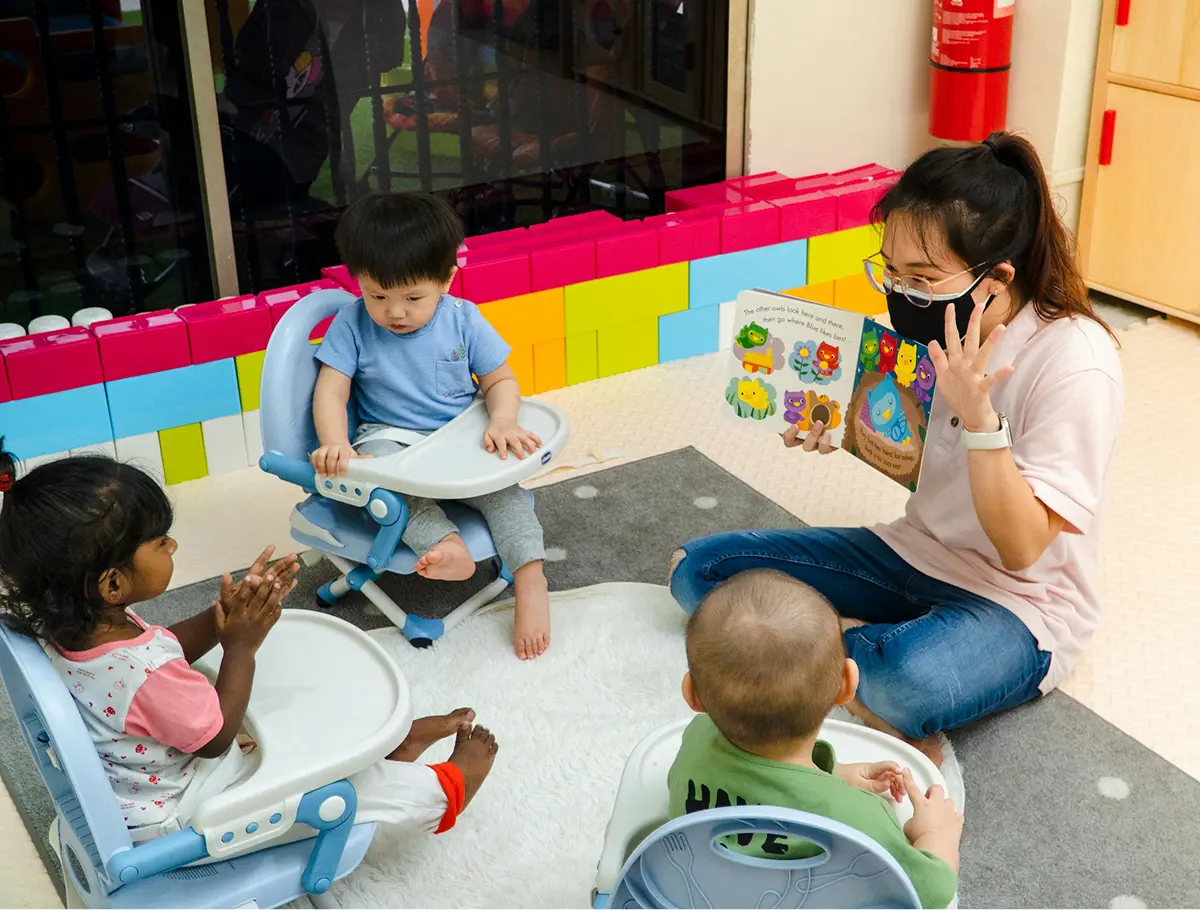 Child engaged in hands-on sensory play at a play-based preschool learning environment