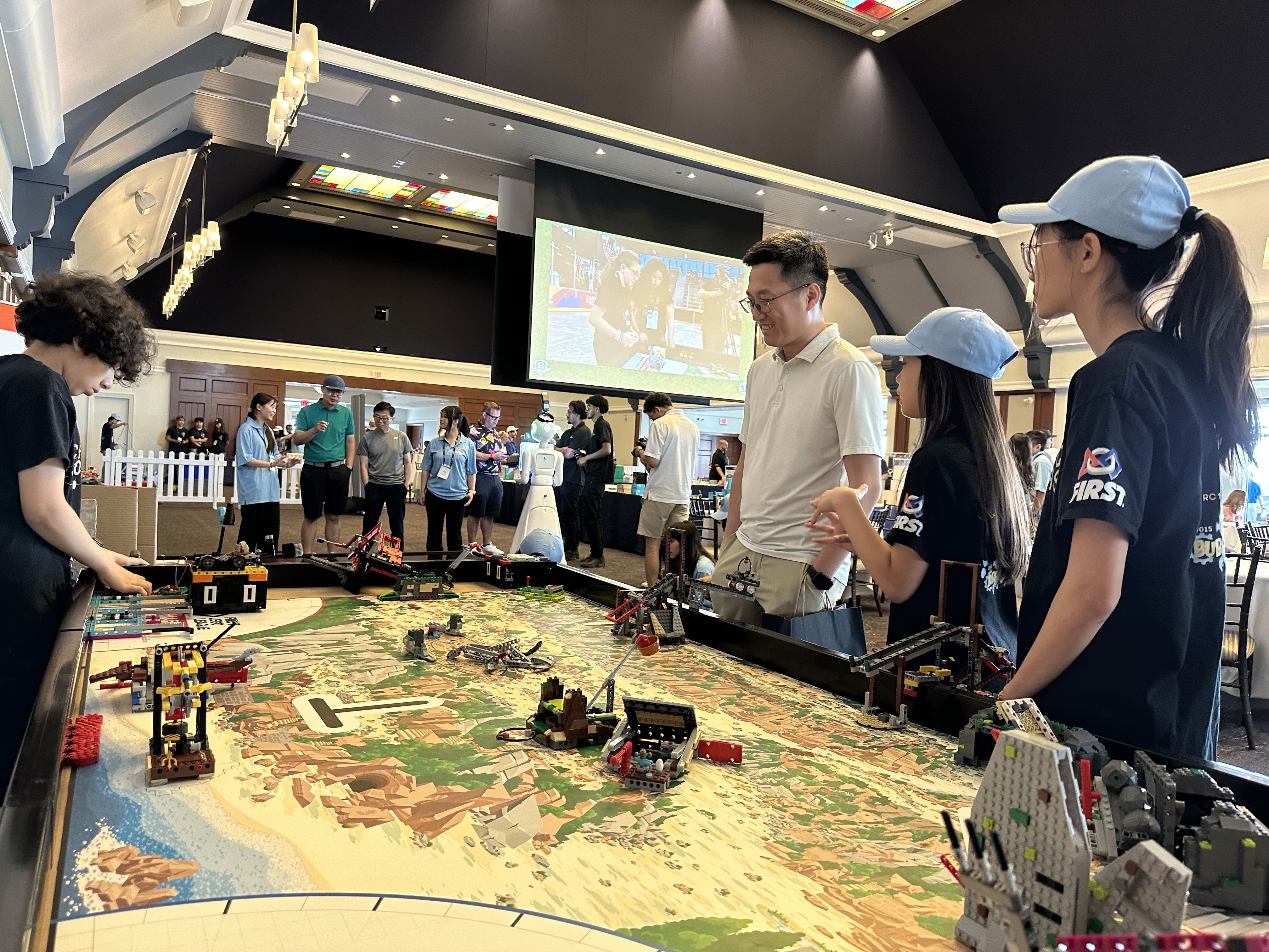 Students from FLL team Solvers of X & Y demonstrate our 2026 robot Ballista to FIRST Canada sponsors at the Angus Glen Golf event.
