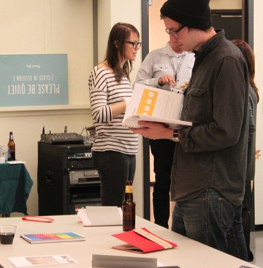 students looking at the book