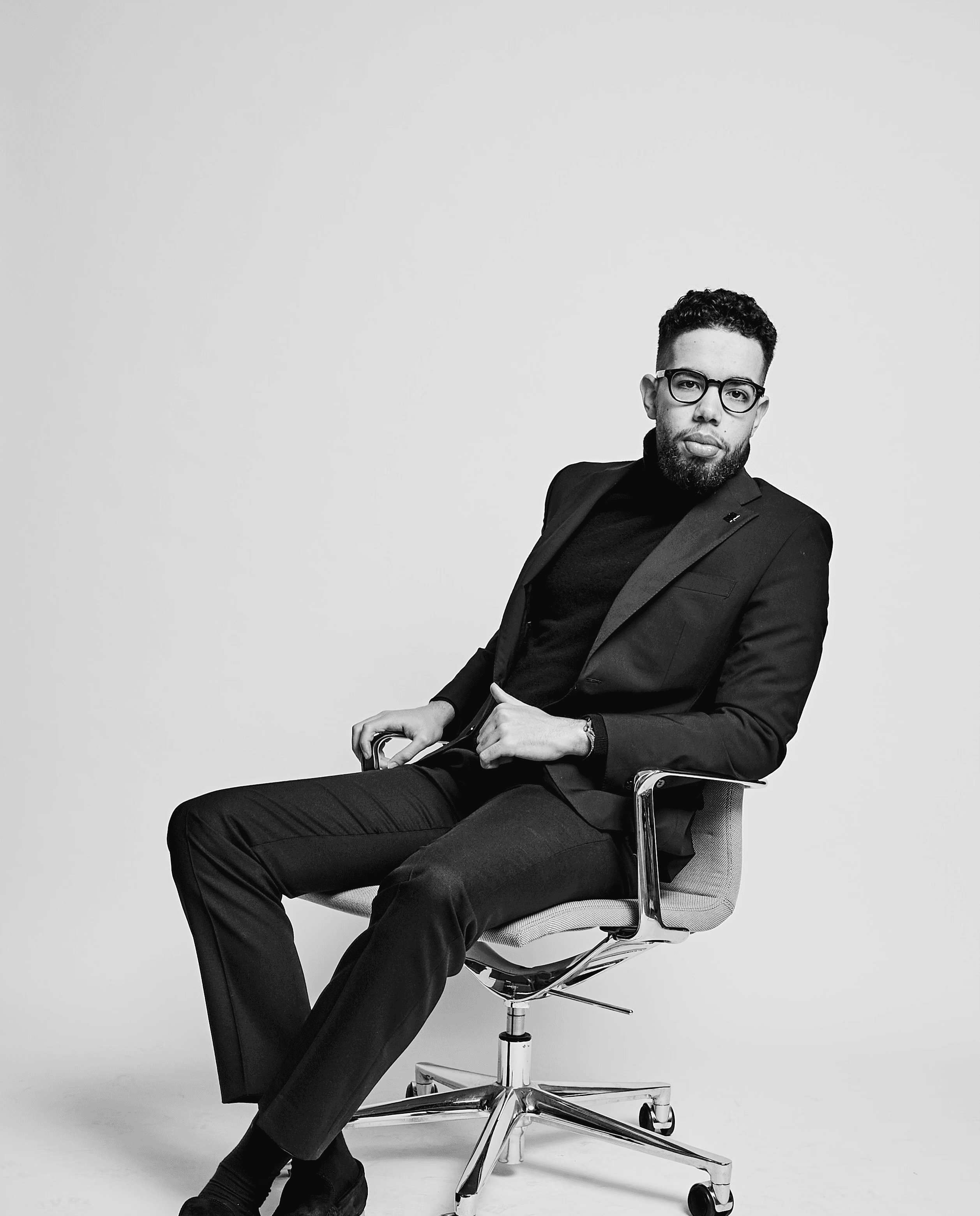 Noel André Warnken sitting on a Chair