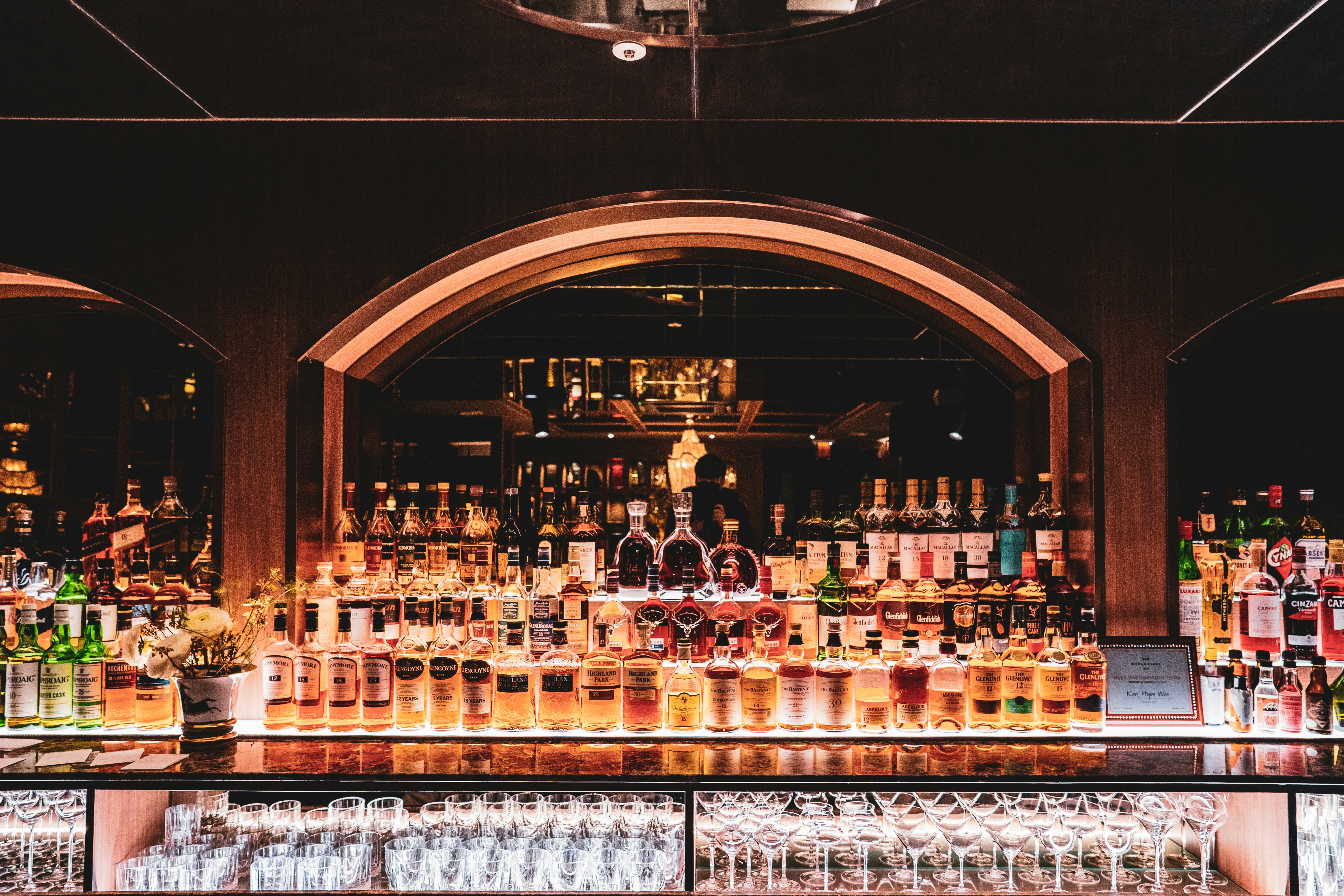 brown wooden shelf with bottles