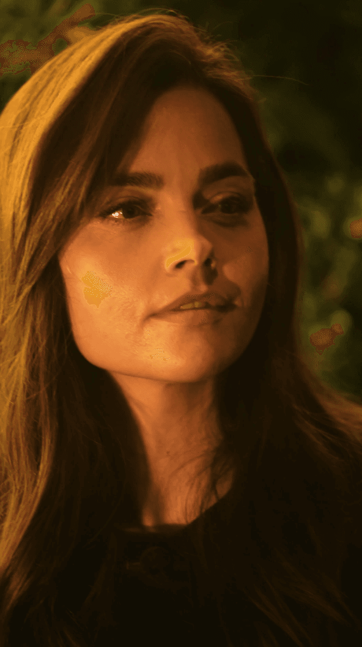 Bride and groom walking on street at night