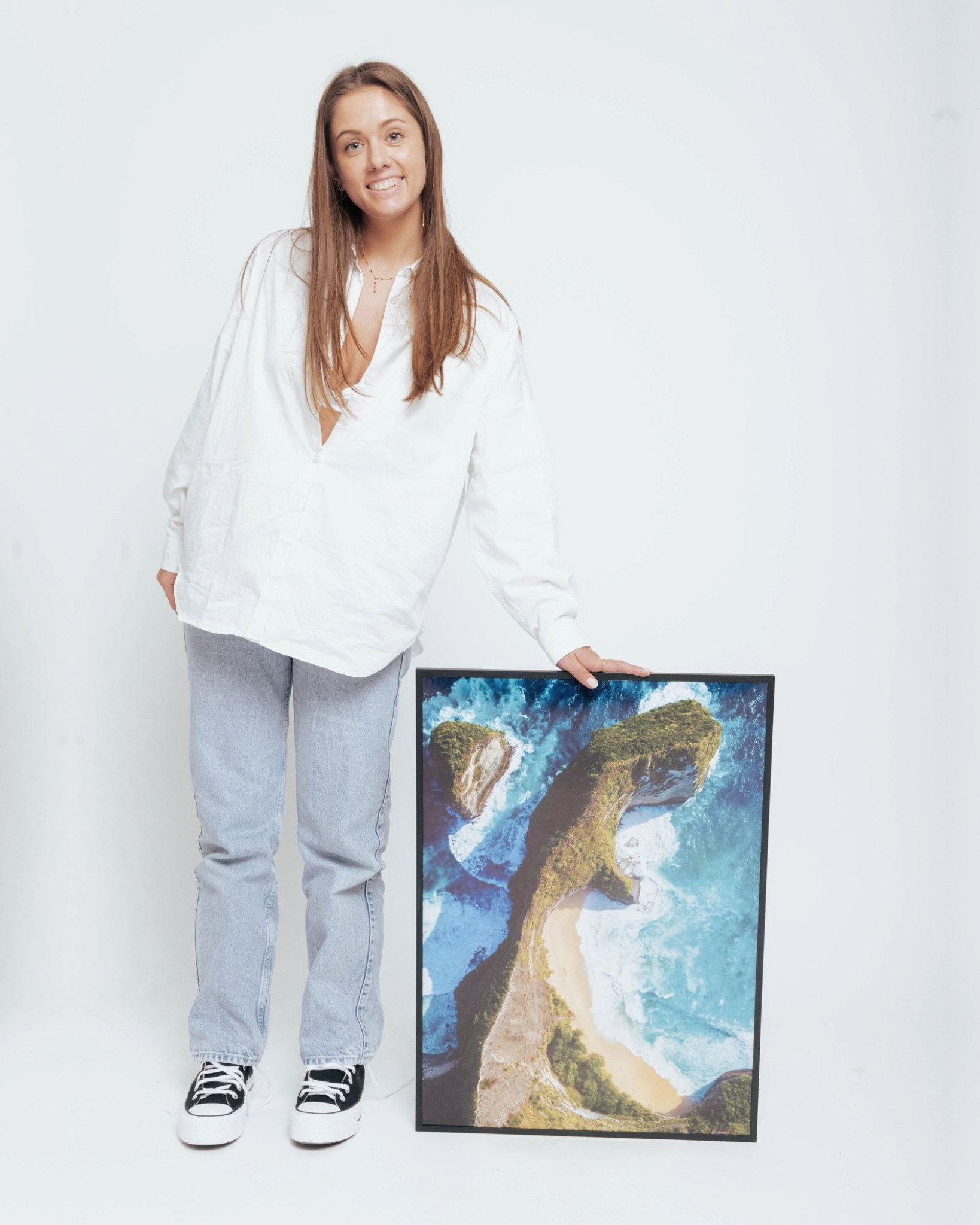 White outline of a classic smiley face followed by the text “Smiley Co” in white serif type on a vivid orange background.