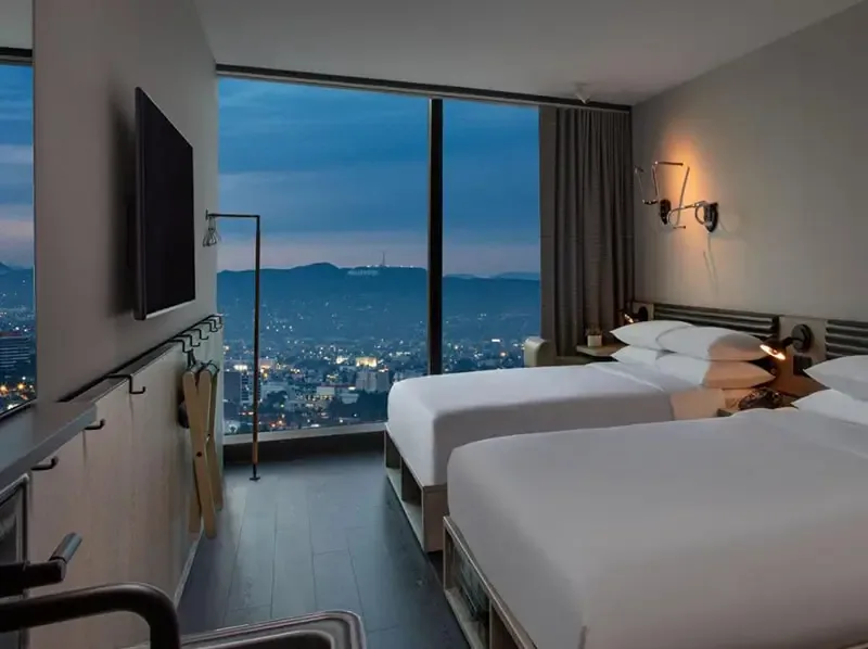 white mattress beside sectional sofa