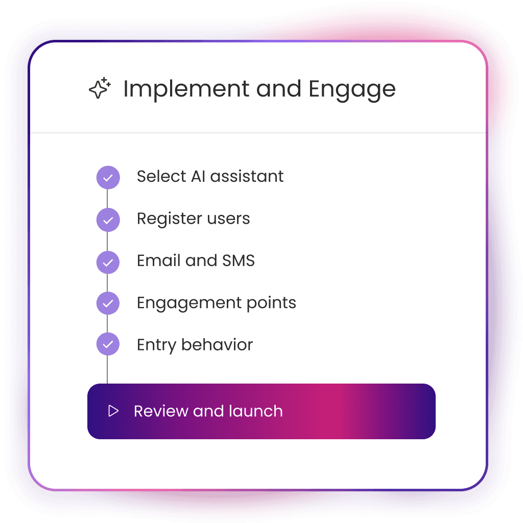 A young person with curly hair smiles at the camera while sitting in front of a laptop against a dark background.