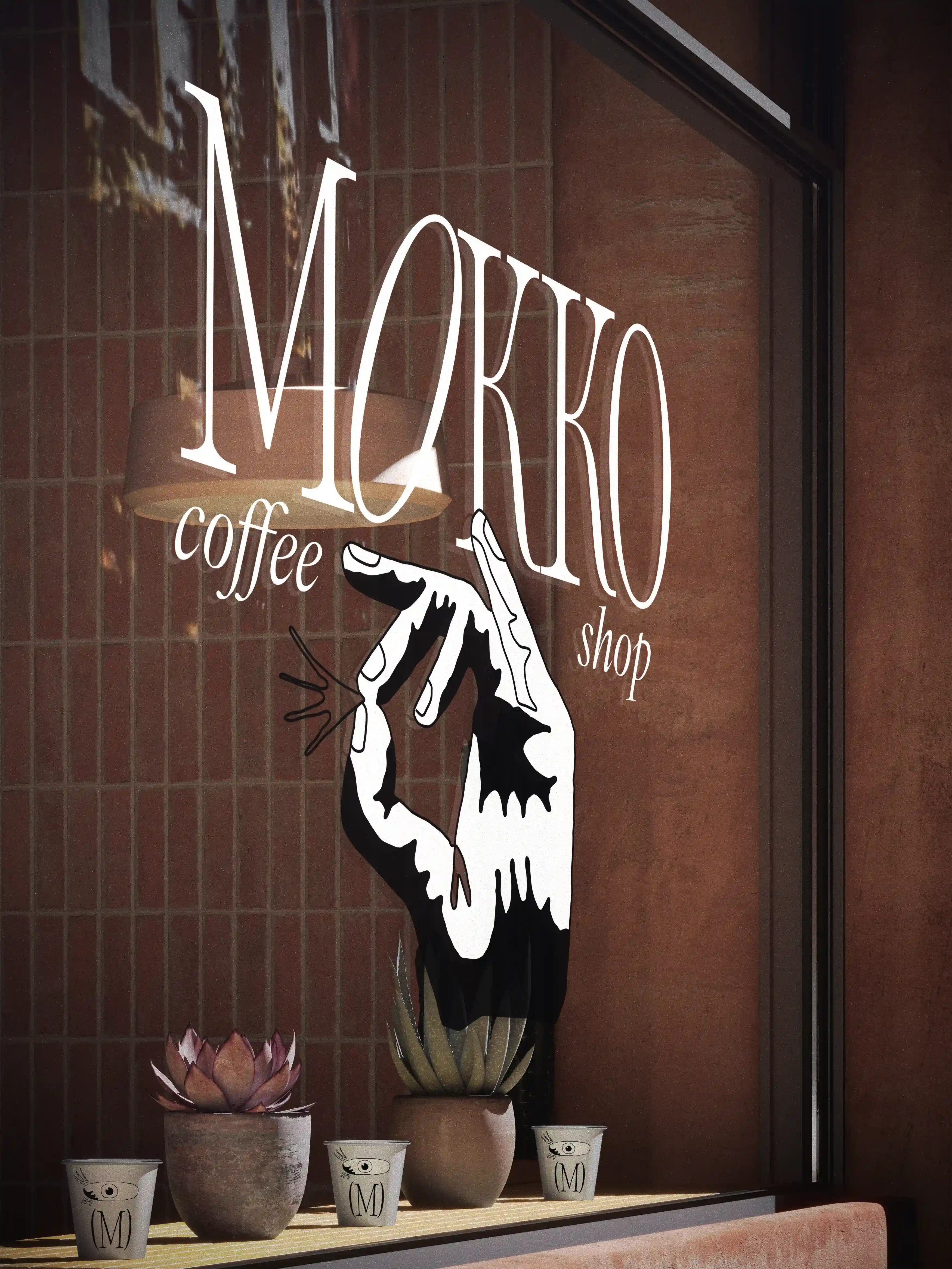 Storefront window with Mokko coffee shop branding and illustrated hand graphic above small potted plants and branded paper cups