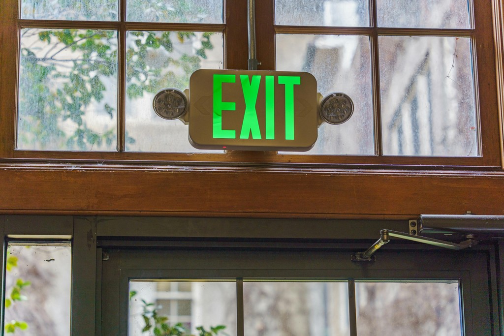Green exit sign illuminated