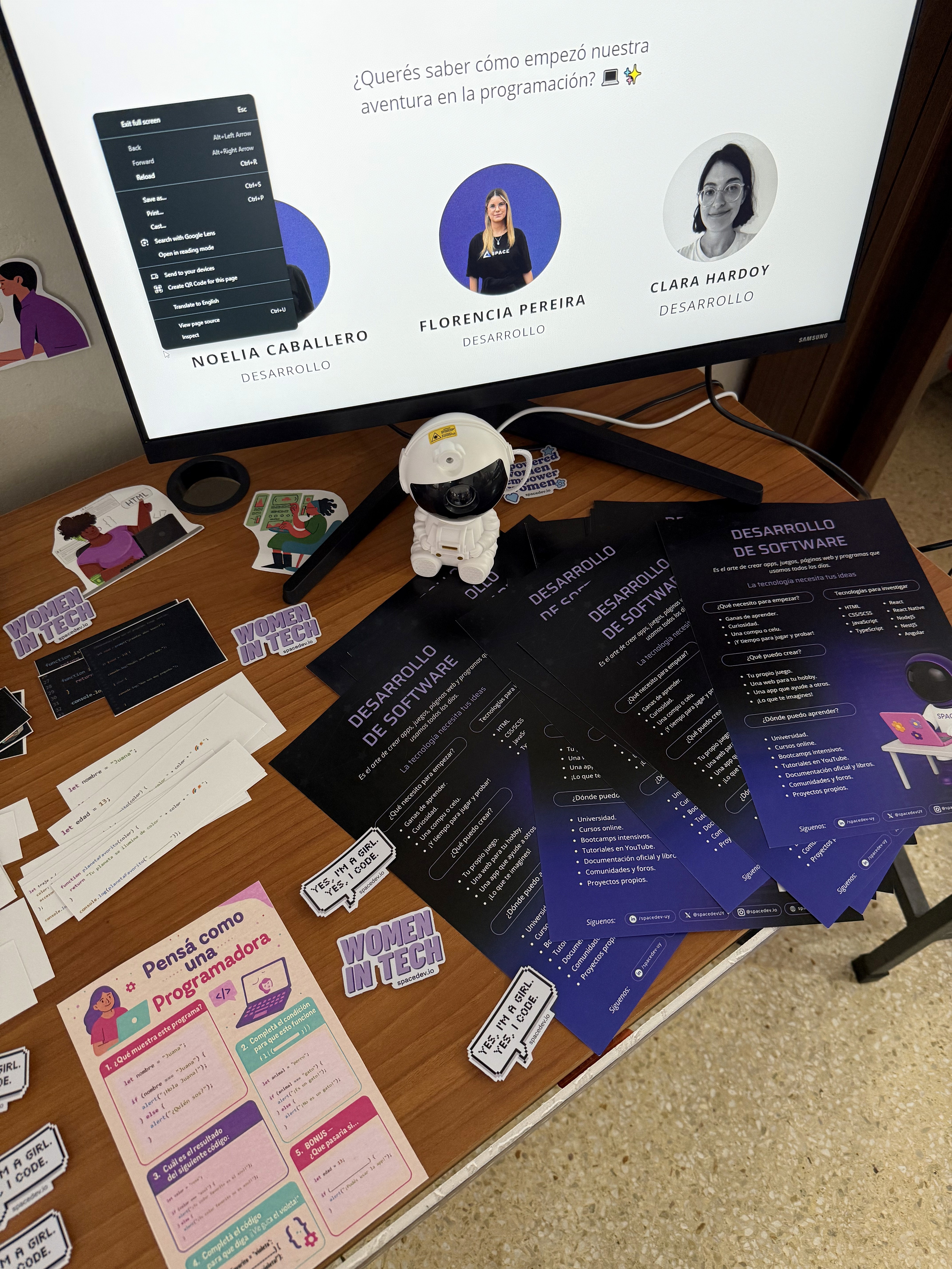 Close up picture of banners, stickers, brochure, and more, designed for the event.