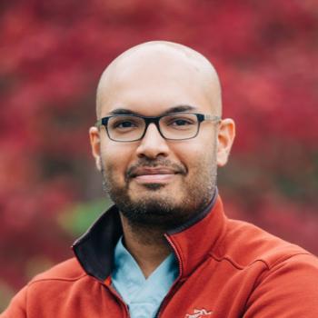 A man smiling for a photo