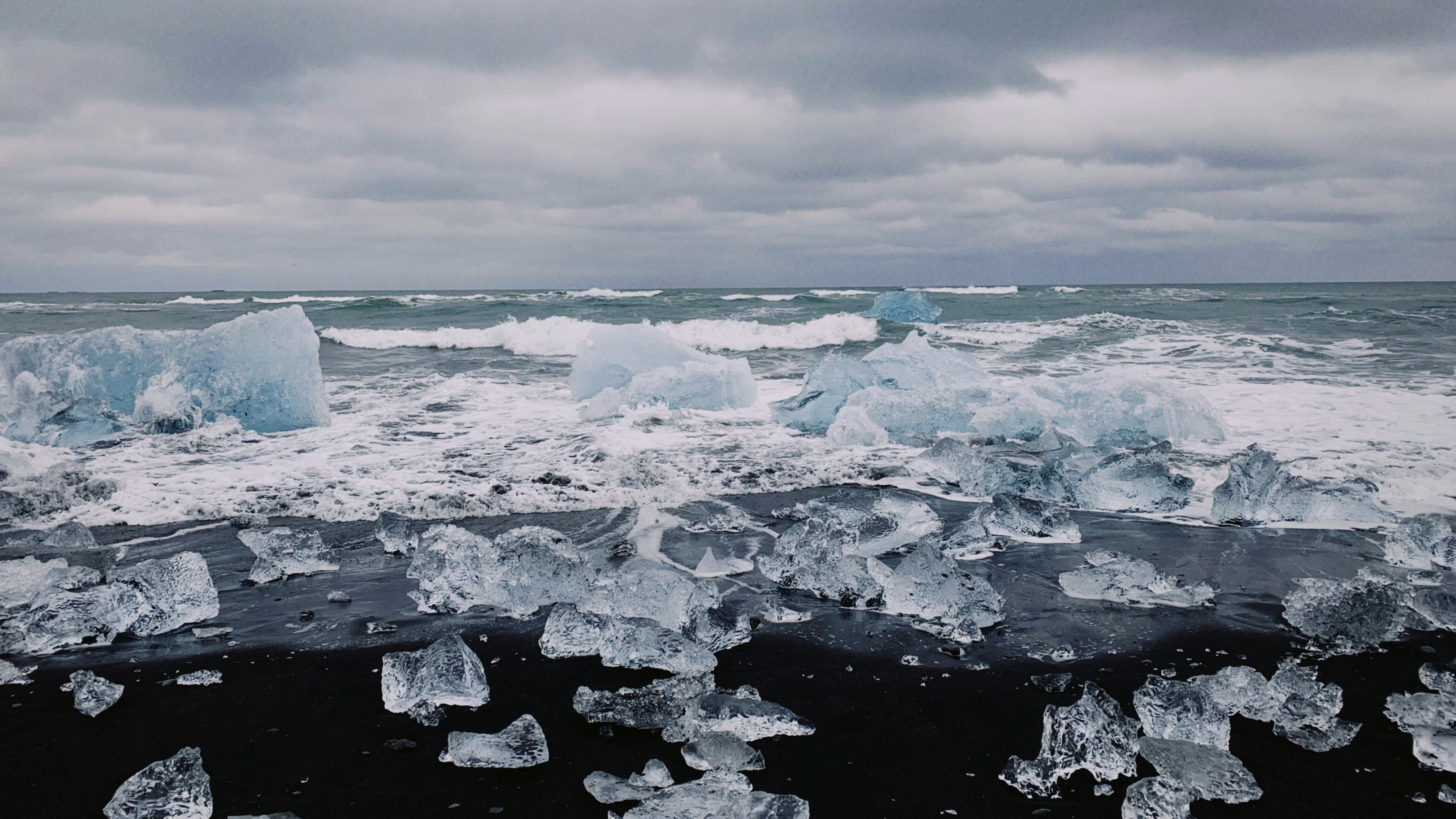 Ice chunks scattered along the shore of Diamond Beach in South Iceland.