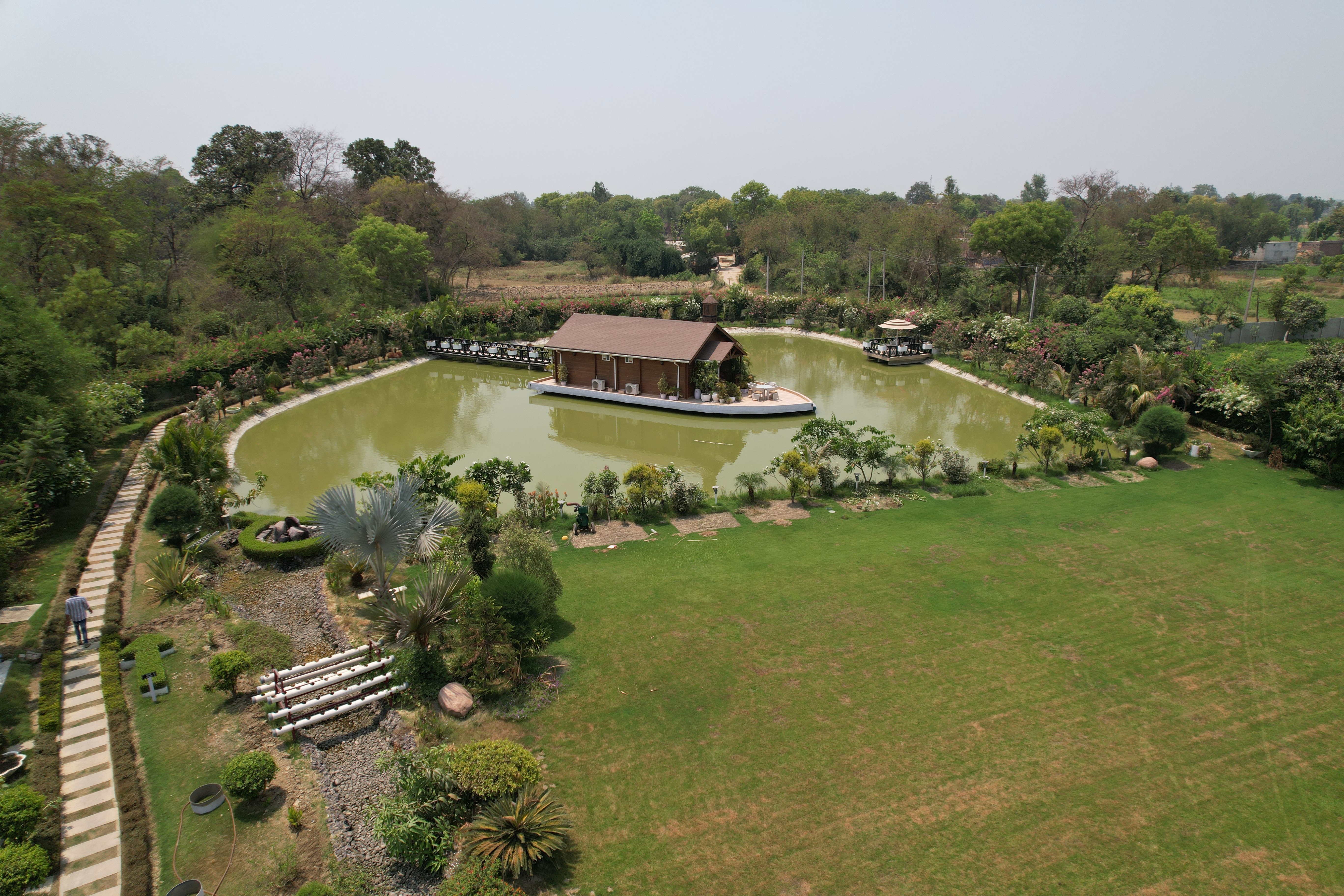 <img src="greenery-plots.jpg" alt="Lush green plots surrounded by nature, offering a serene and eco-friendly second home investment opportunity" />
