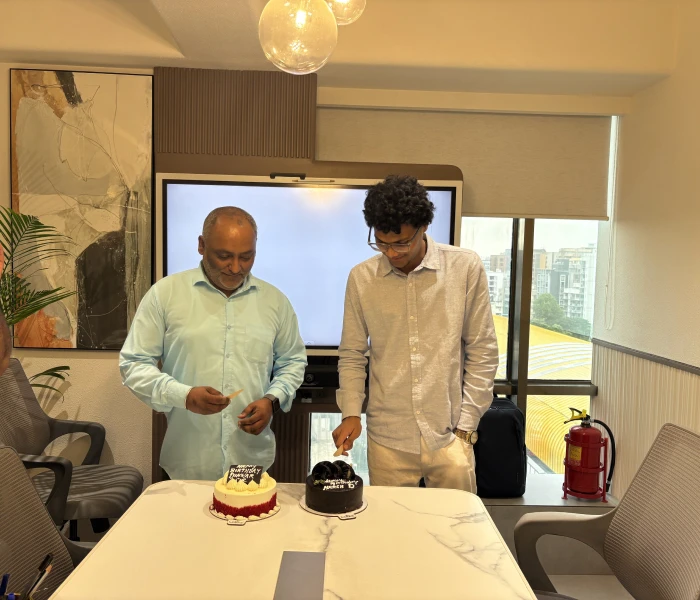 The image is from Instalogic, business intelligence, capturing staff enjoying a celebration.