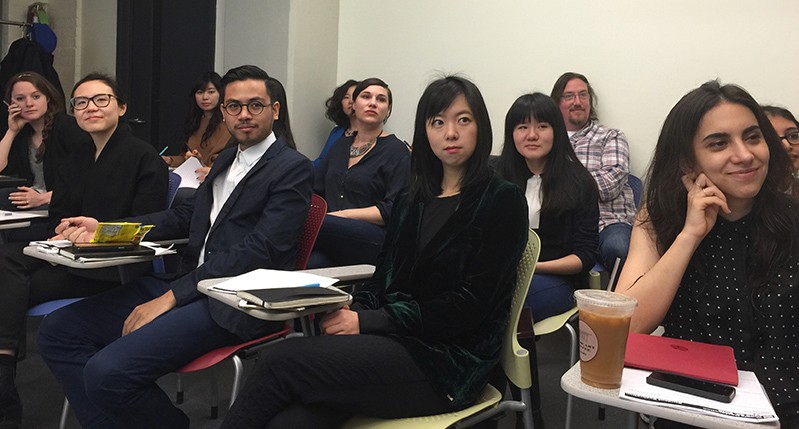 A photo of a group of students sitting in a class room.