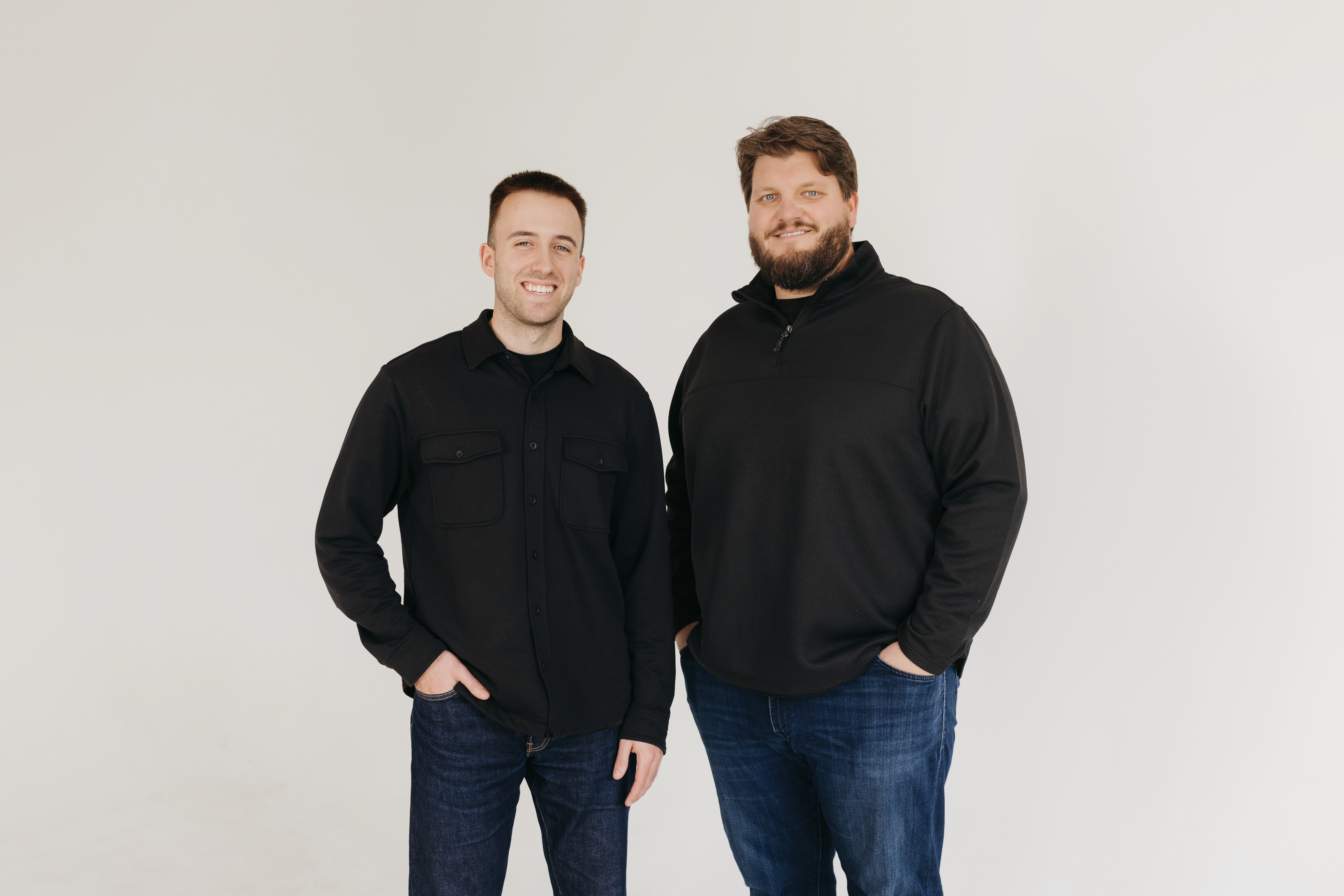 Men and women are sitting at a table.